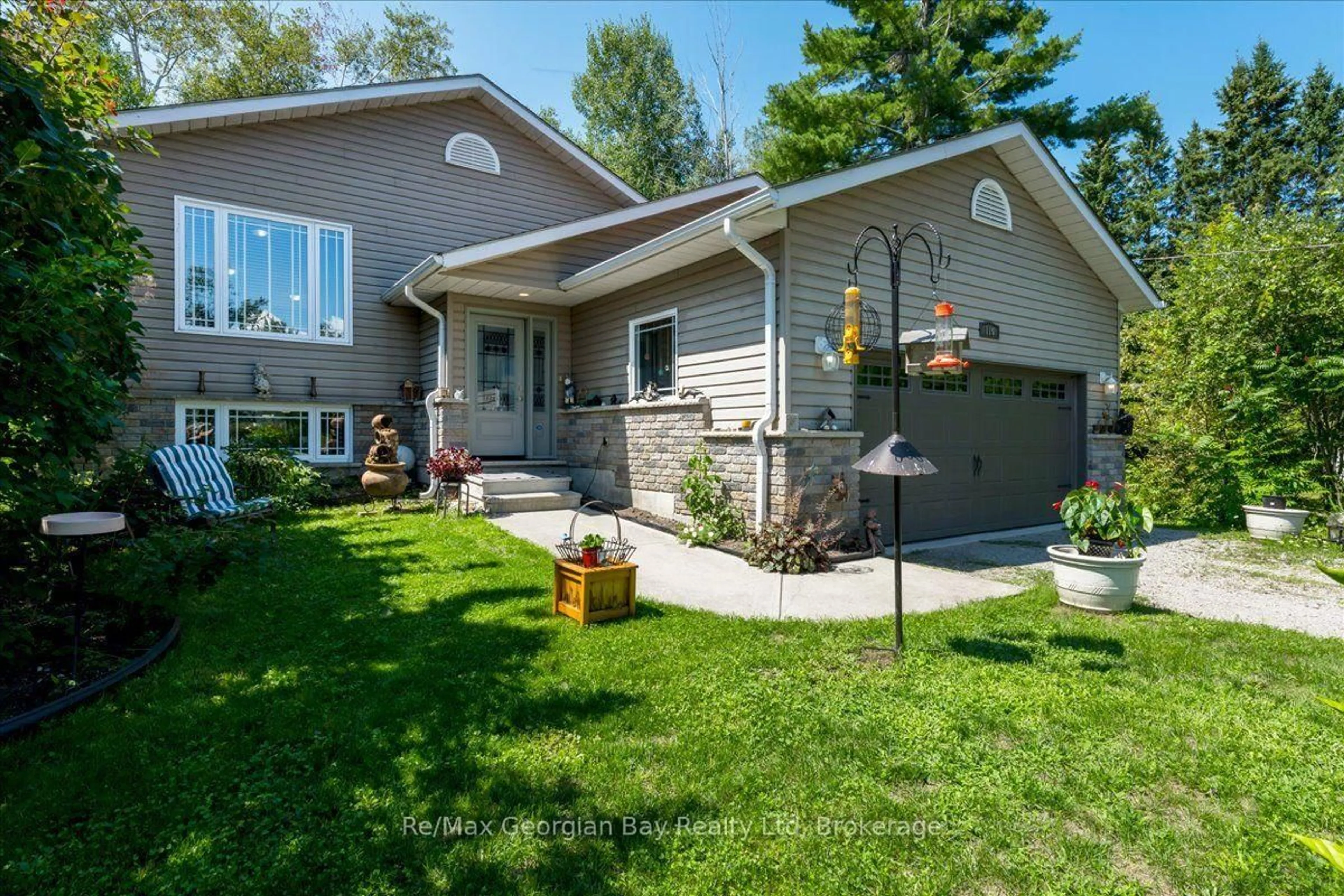 Home with vinyl exterior material, street for 110 Maskinonge Rd, Tay Ontario L0K 2A0