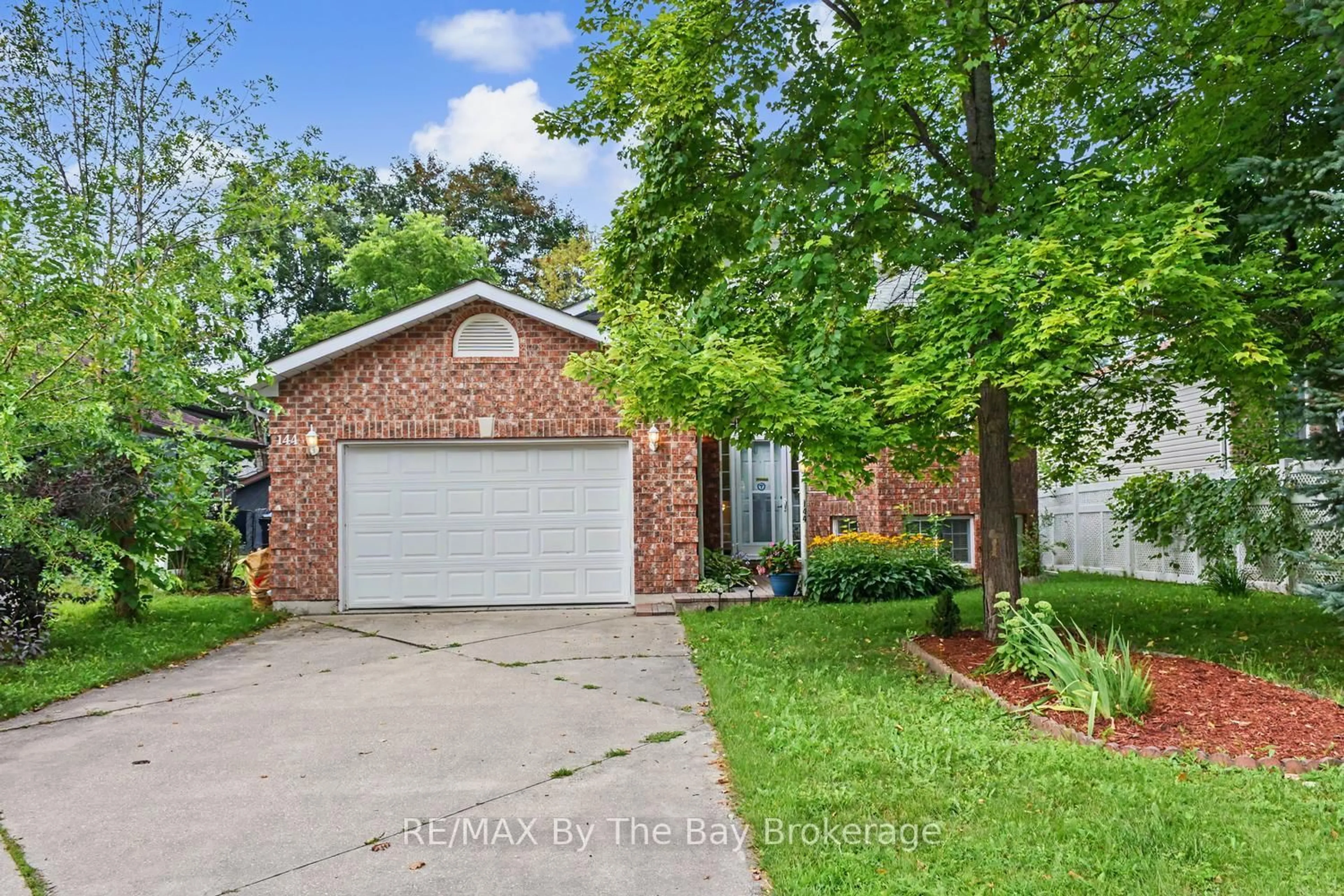 Home with brick exterior material, street for 144 SMALLMAN Dr, Wasaga Beach Ontario L9Z 1L3