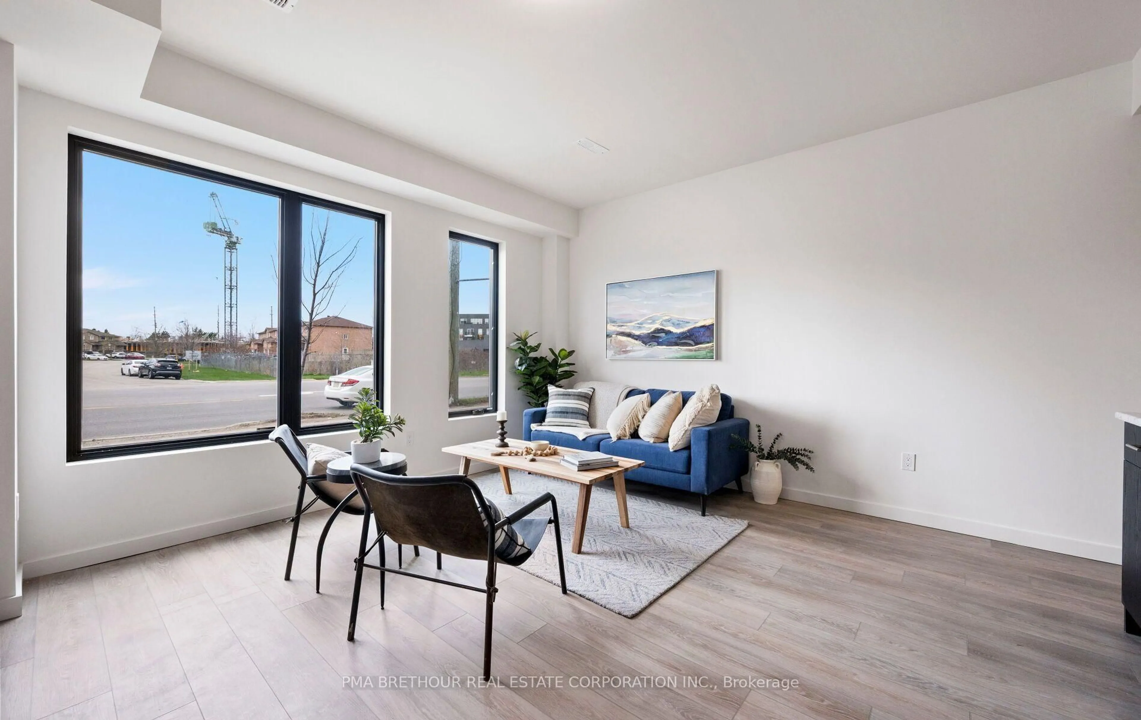 Living room with furniture, wood/laminate floor for 17 Rainwater Lane, Barrie Ontario L4N 9J6