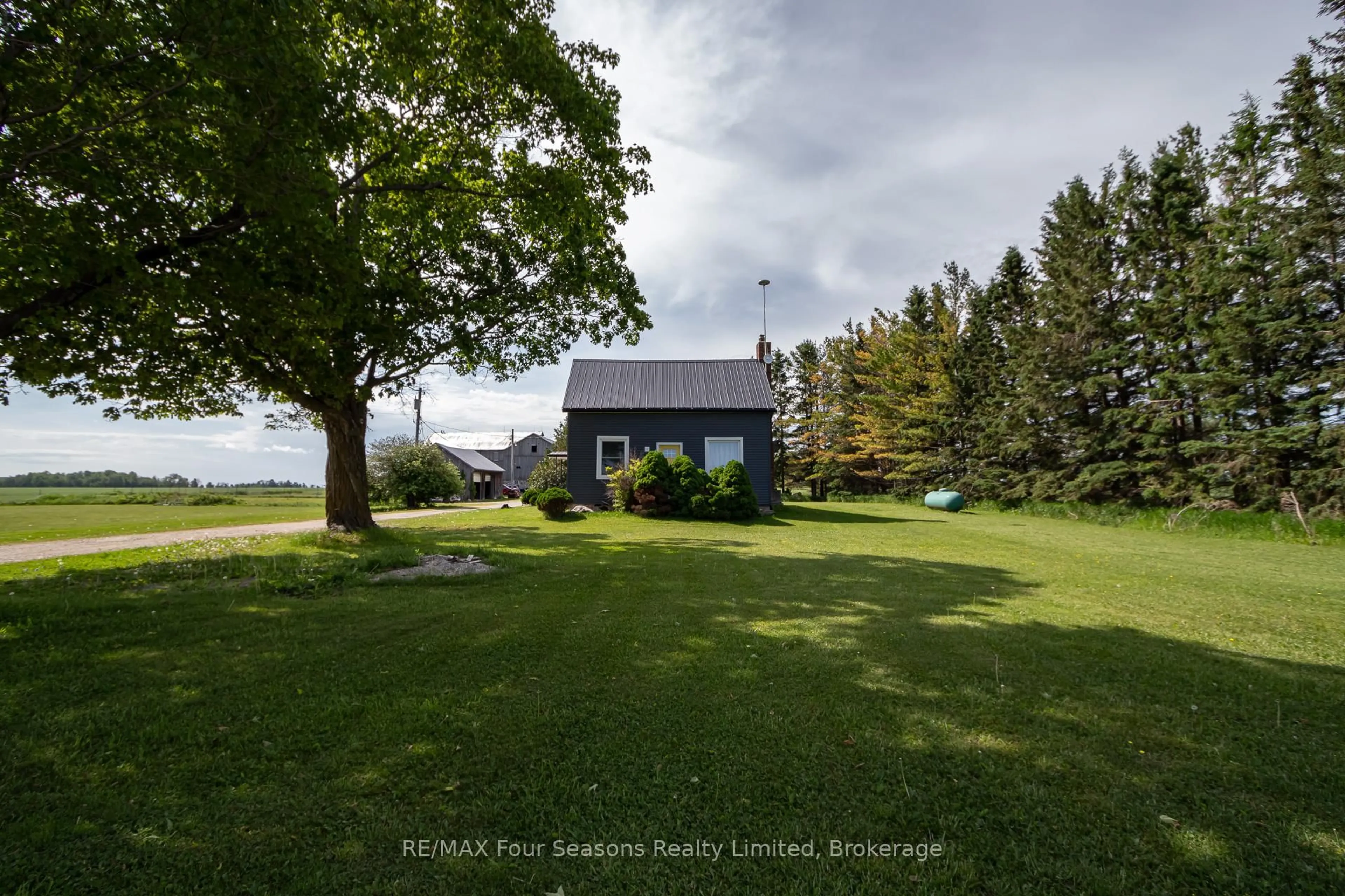A pic from outside/outdoor area/front of a property/back of a property/a pic from drone, water/lake/river/ocean view for 5803 26 Highway, Clearview Ontario L0M 1S0