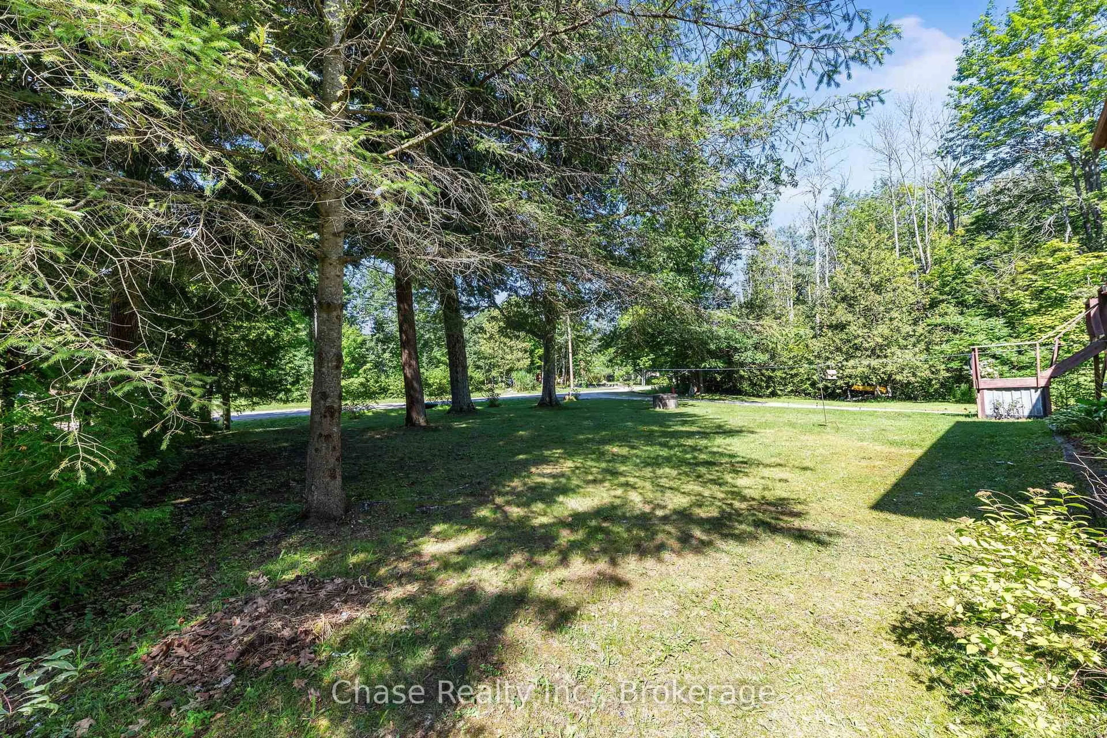 A pic from outside/outdoor area/front of a property/back of a property/a pic from drone, forest/trees view for 655 Tiny Beaches Rd, Tiny Ontario L0L 2J0