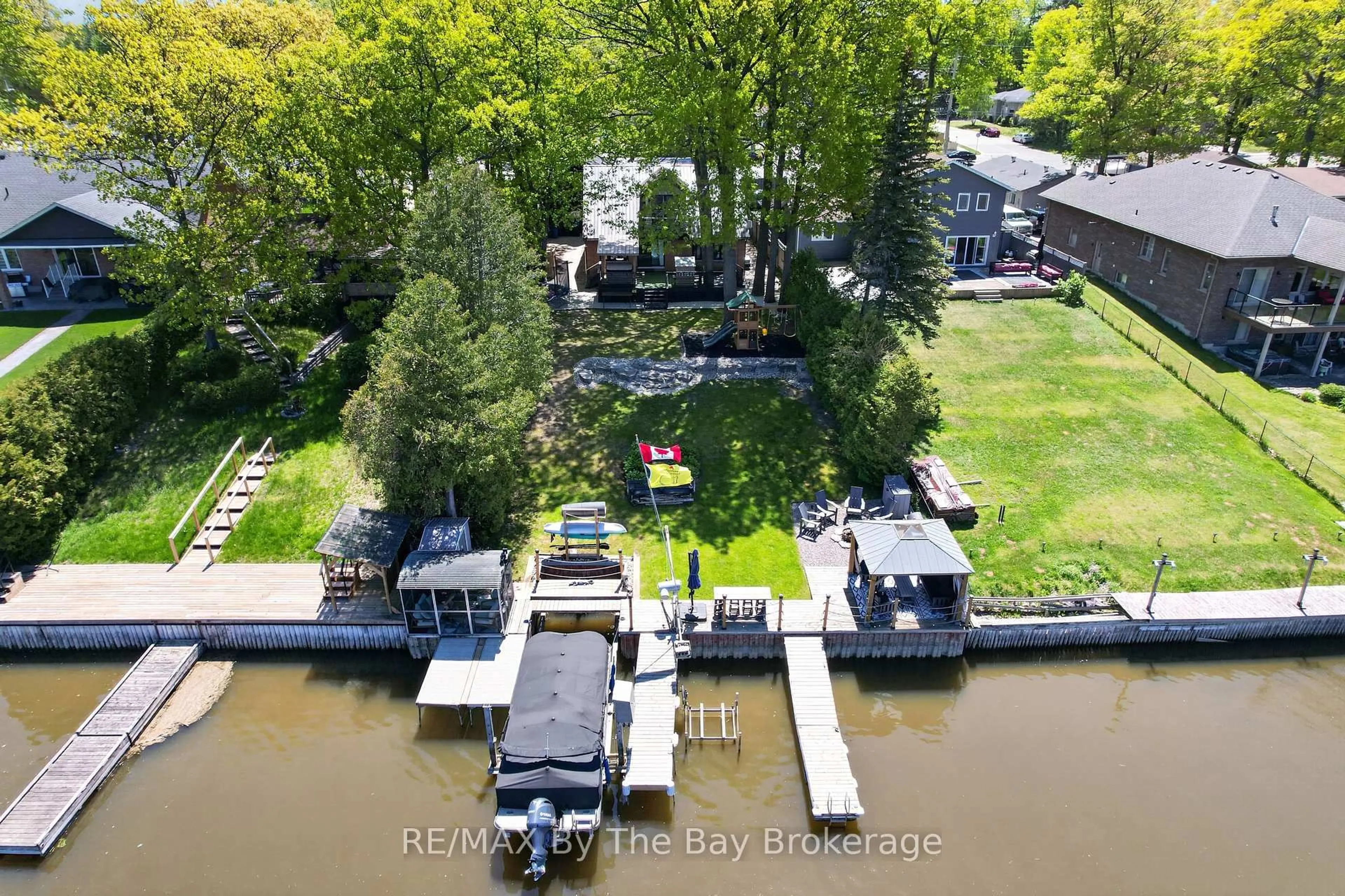 A pic from outside/outdoor area/front of a property/back of a property/a pic from drone, water/lake/river/ocean view for 1416 River Rd, Wasaga Beach Ontario L9Z 2W5