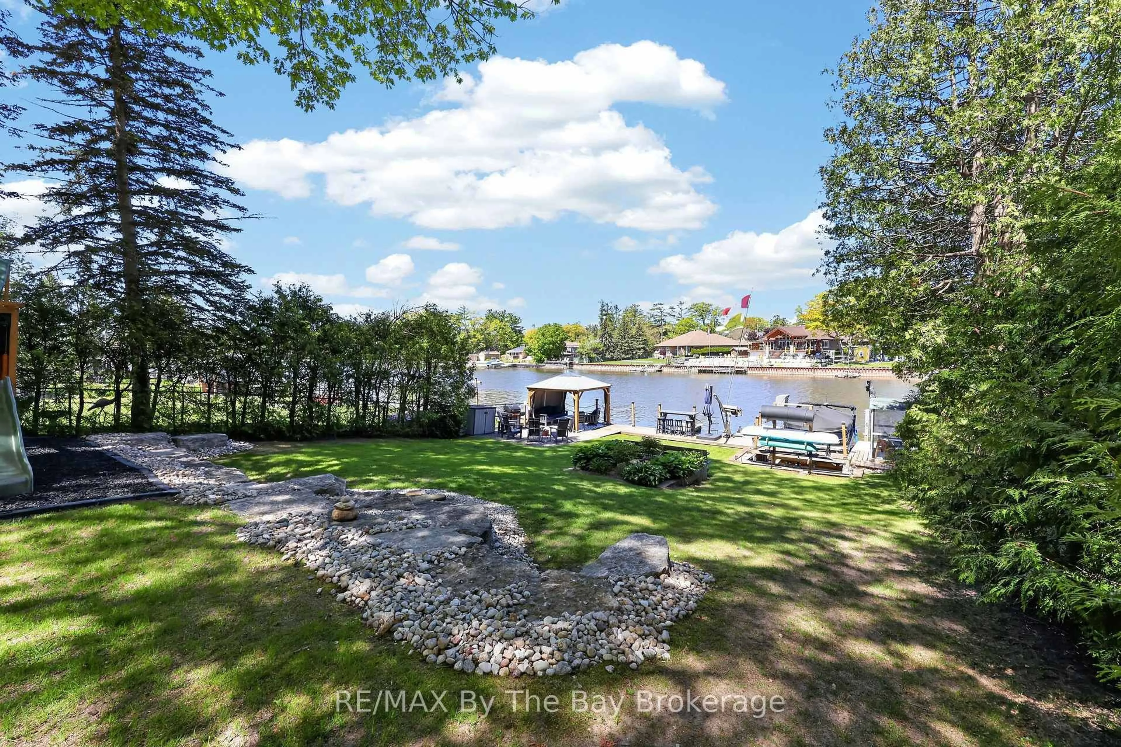 A pic from outside/outdoor area/front of a property/back of a property/a pic from drone, water/lake/river/ocean view for 1416 River Rd, Wasaga Beach Ontario L9Z 2W5