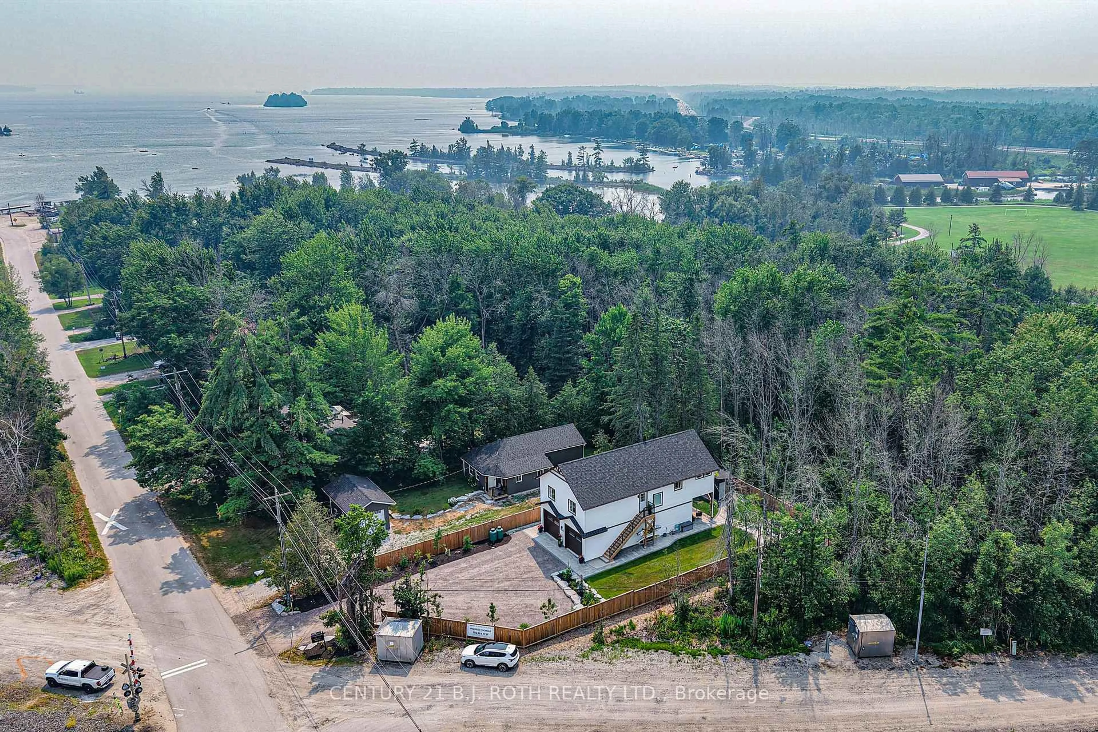 A pic from outside/outdoor area/front of a property/back of a property/a pic from drone, water/lake/river/ocean view for 3332 Quetton St, Severn Ontario L0K 2B0