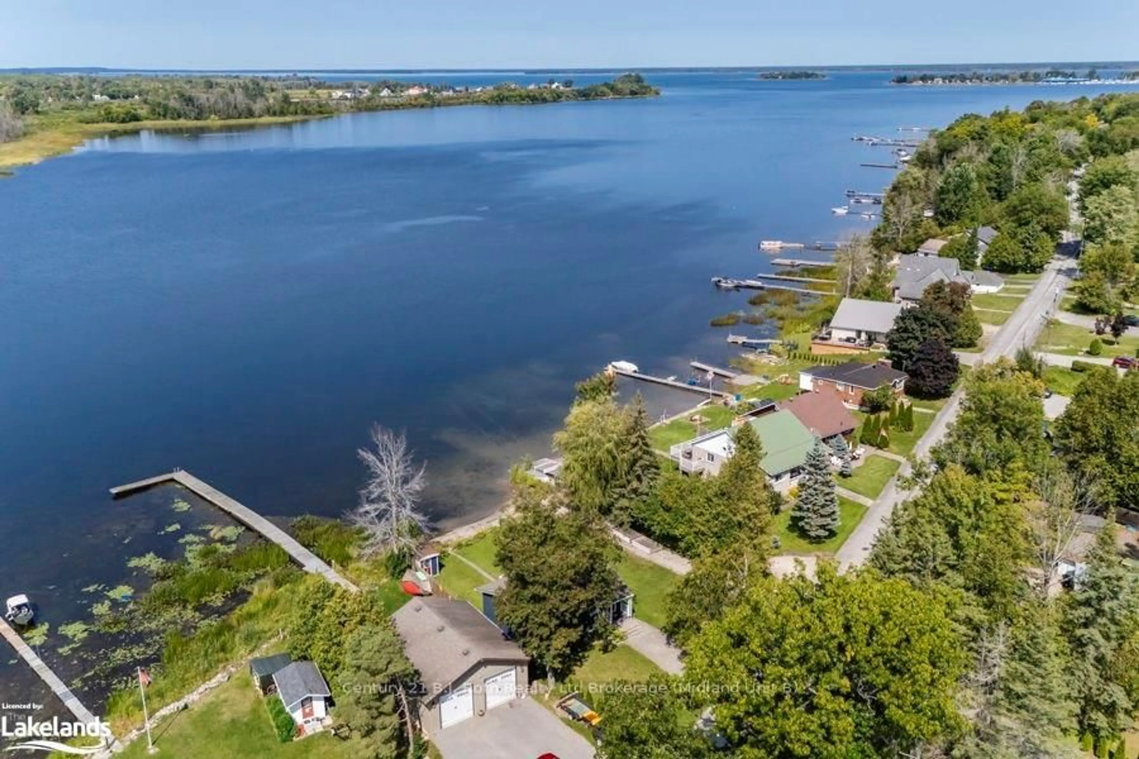 A pic from outside/outdoor area/front of a property/back of a property/a pic from drone, water/lake/river/ocean view for 142 - 140 MITCHELLS BEACH Rd, Tay Ontario L0K 2A0