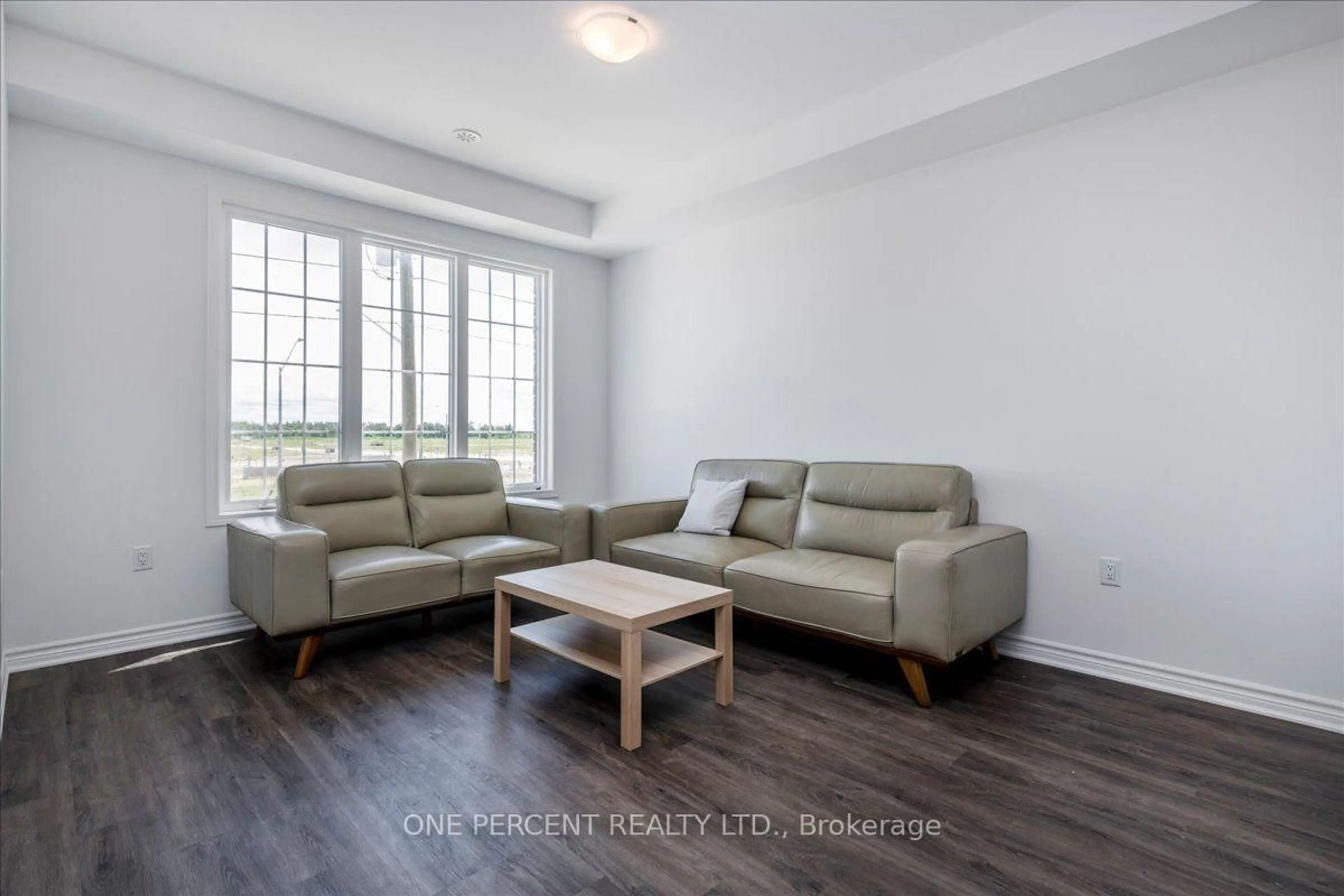 Living room with furniture, wood/laminate floor for 16 Pearen Lane, Barrie Ontario L9J 0Z7