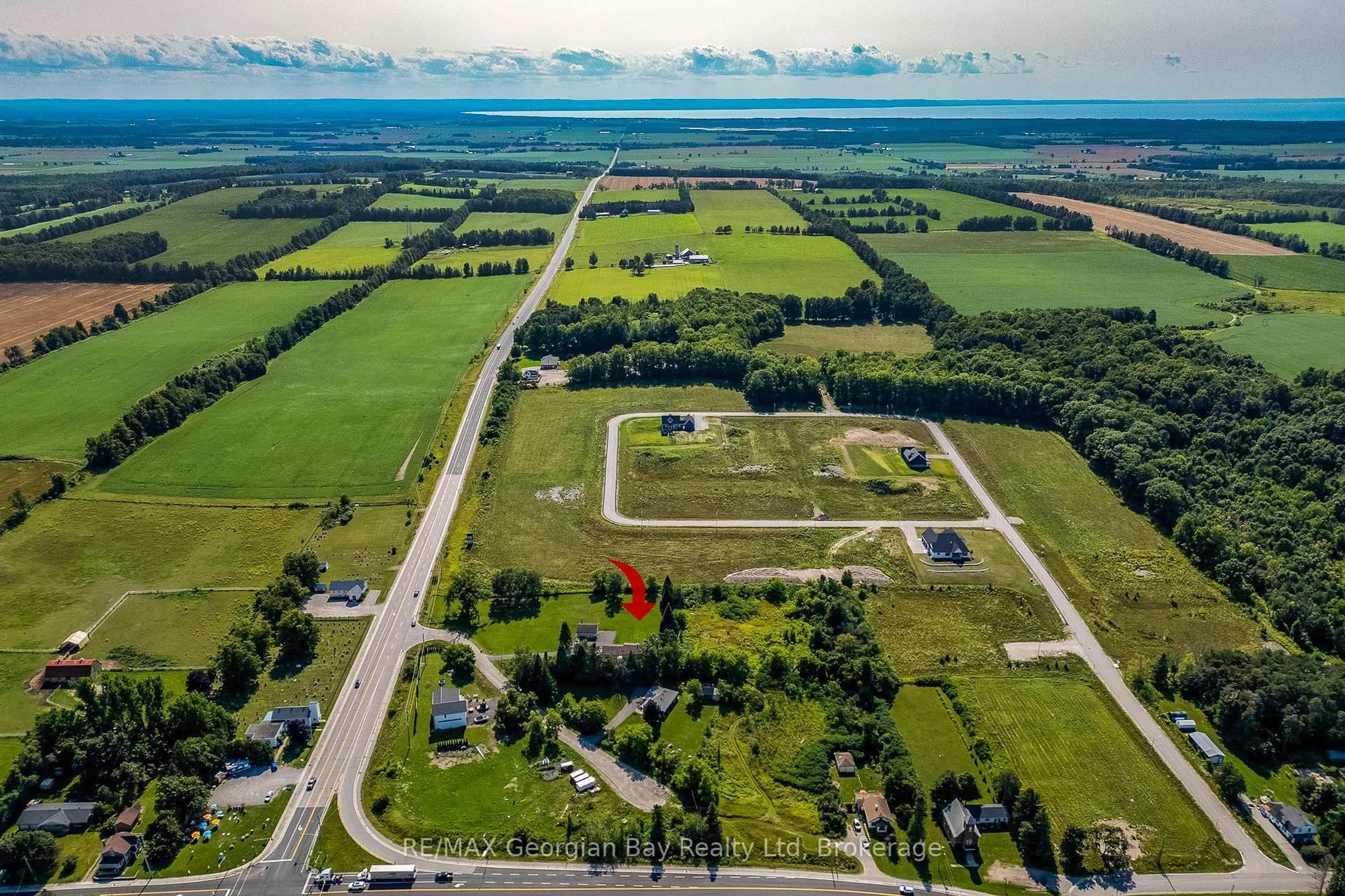 A pic from outside/outdoor area/front of a property/back of a property/a pic from drone, water/lake/river/ocean view for 1046 Henry St, Tay Ontario L0L 1P0