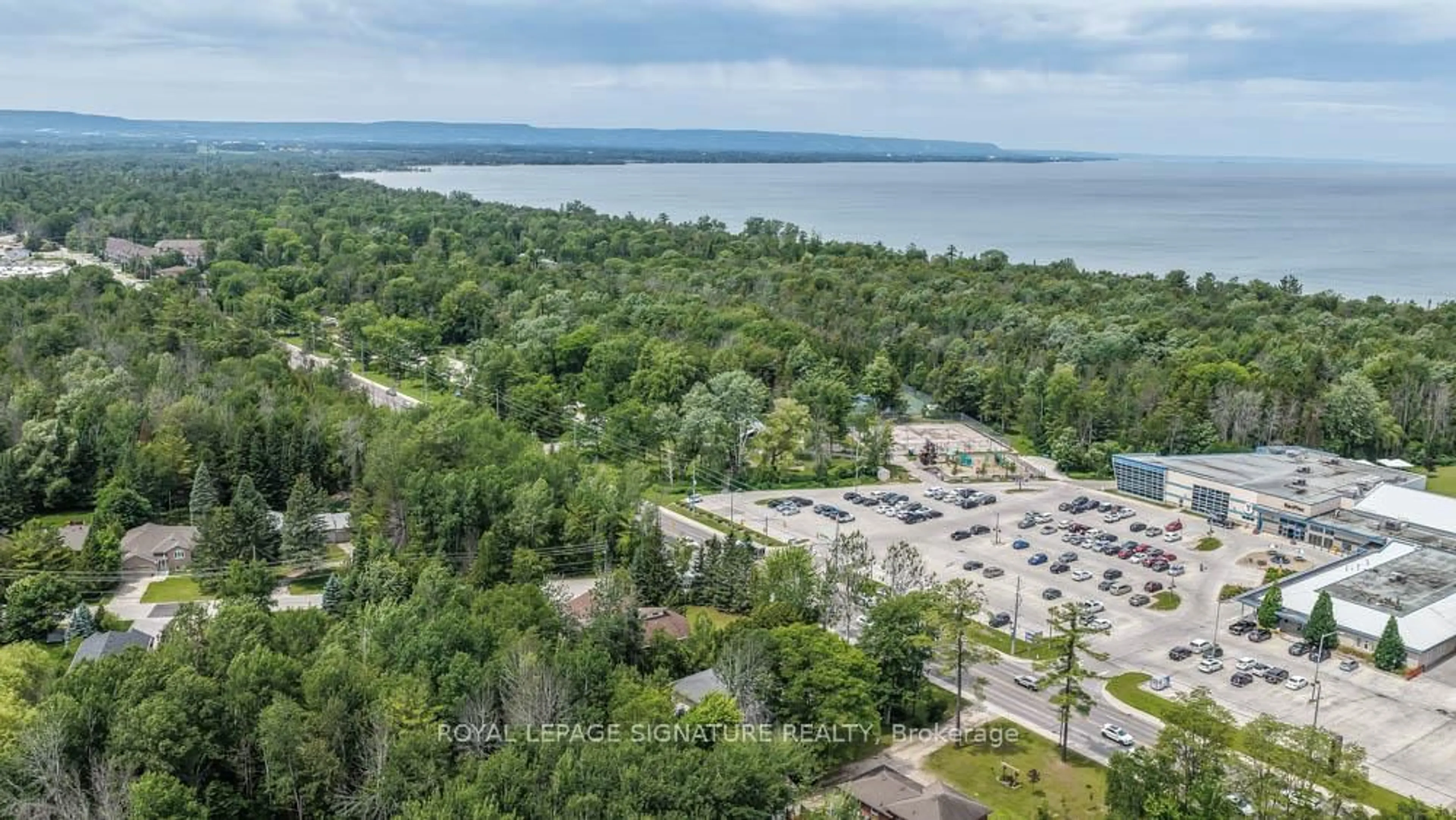 A pic from outside/outdoor area/front of a property/back of a property/a pic from drone, water/lake/river/ocean view for 1729 Mosley St, Wasaga Beach Ontario L9Z 1Z8