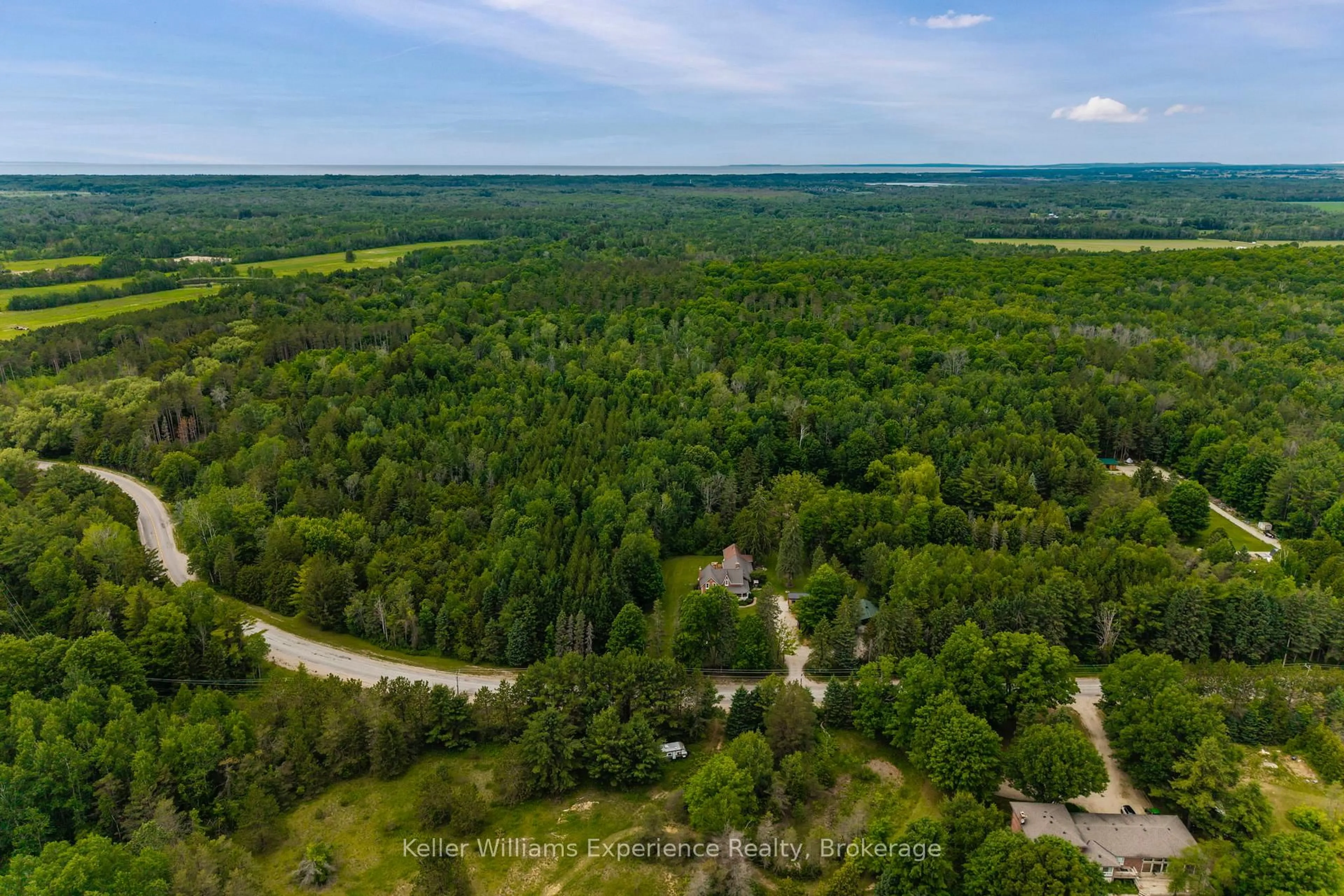 A pic from outside/outdoor area/front of a property/back of a property/a pic from drone, forest/trees view for 3744 Flos 4 Rd, Springwater Ontario L0M 1S0