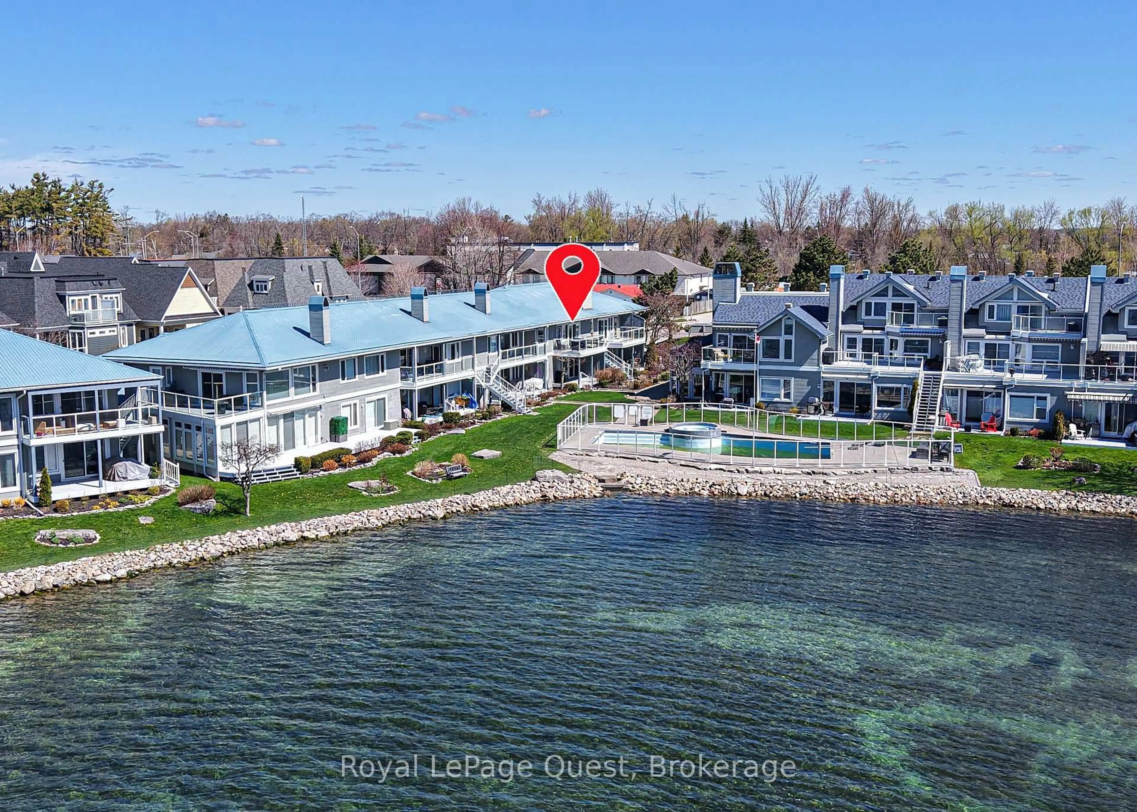 A pic from outside/outdoor area/front of a property/back of a property/a pic from drone, water/lake/river/ocean view for 585 Atherley Rd #202, Orillia Ontario L3V 7L5