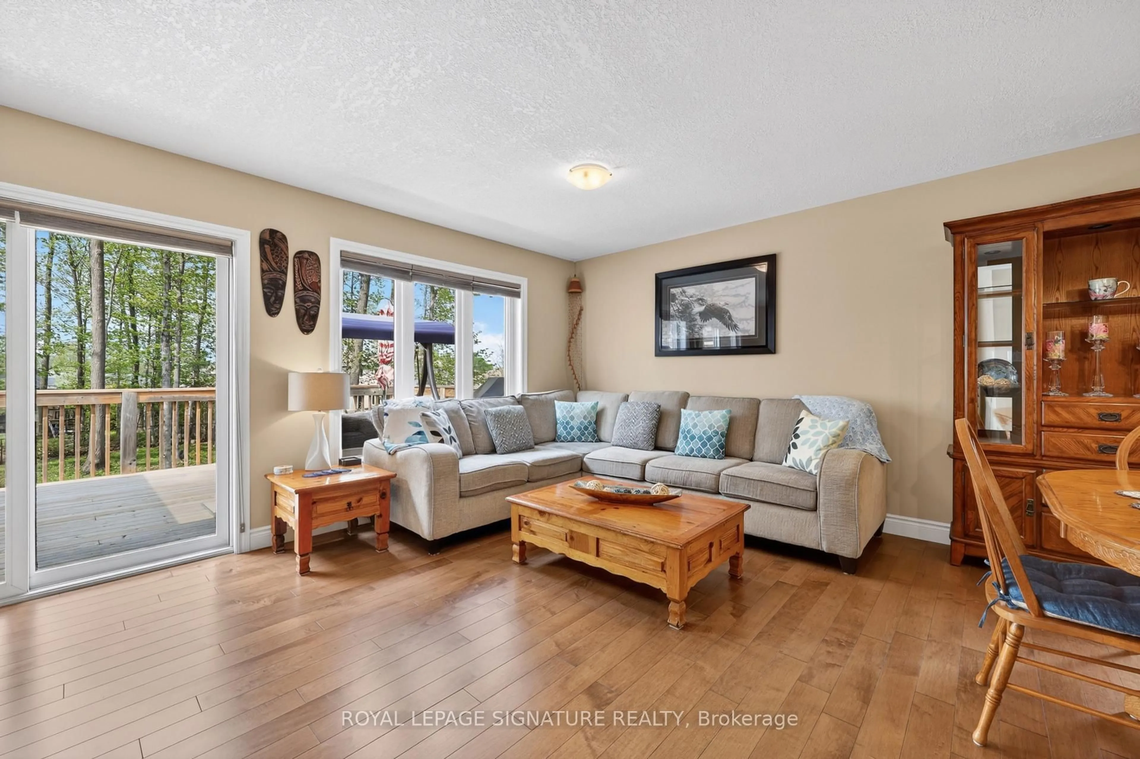 Living room with furniture, wood/laminate floor for 22 Hunter Ave, Tay Ontario L0K 2A0