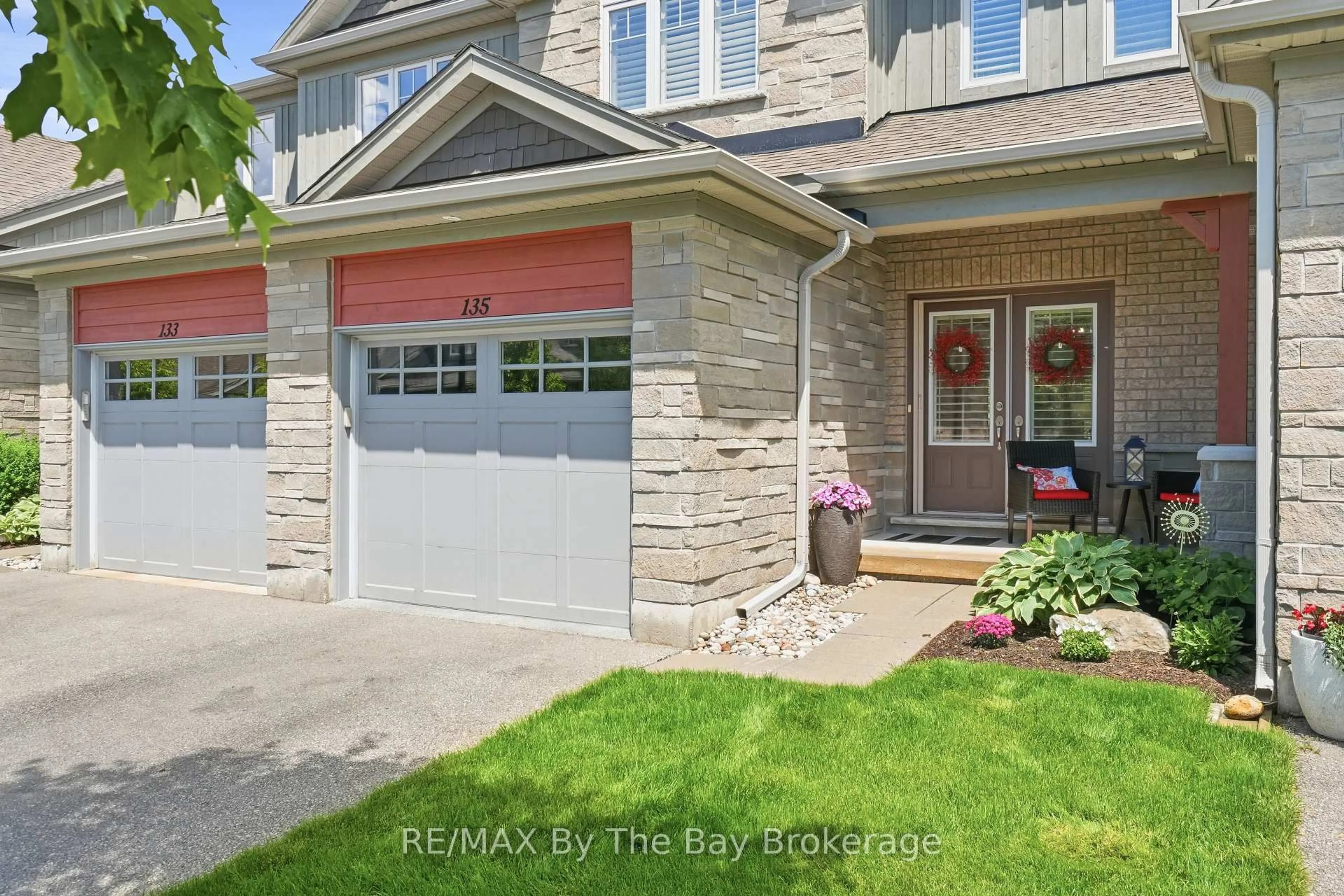 Home with brick exterior material, street for 135 Conservation Way, Collingwood Ontario L9Y 0G9