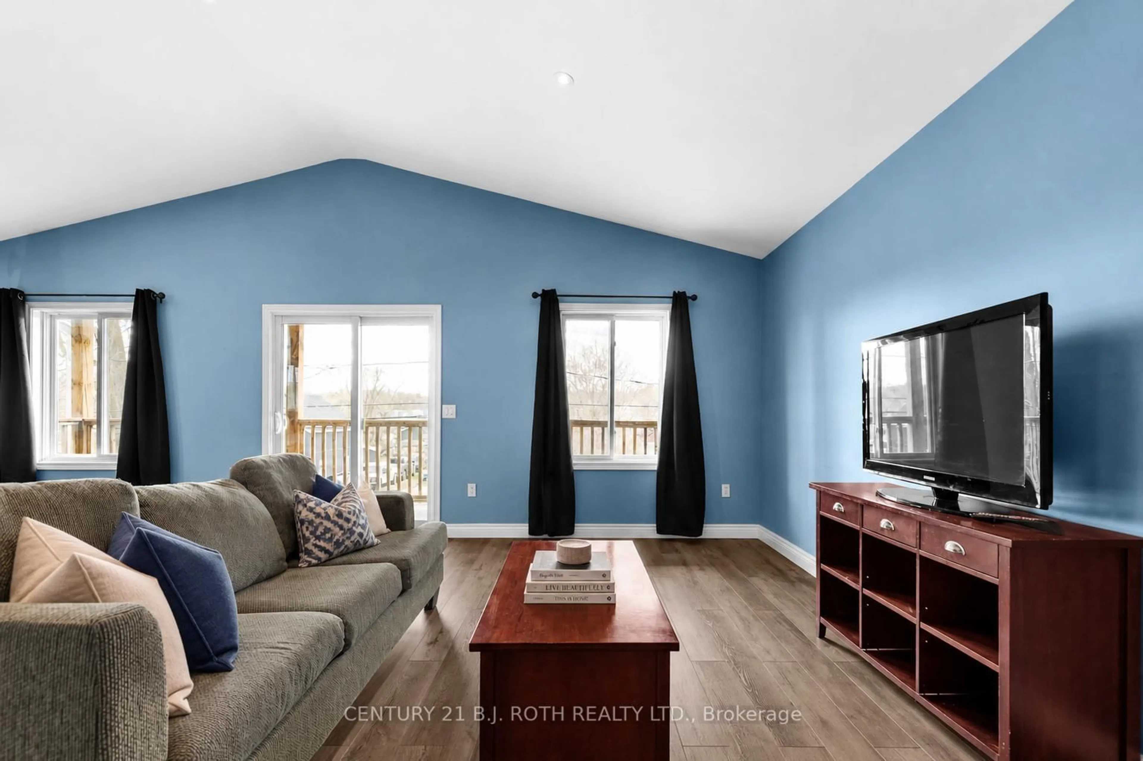 Living room with furniture, wood/laminate floor for 102 Dunlop St, Orillia Ontario L3V 5P4