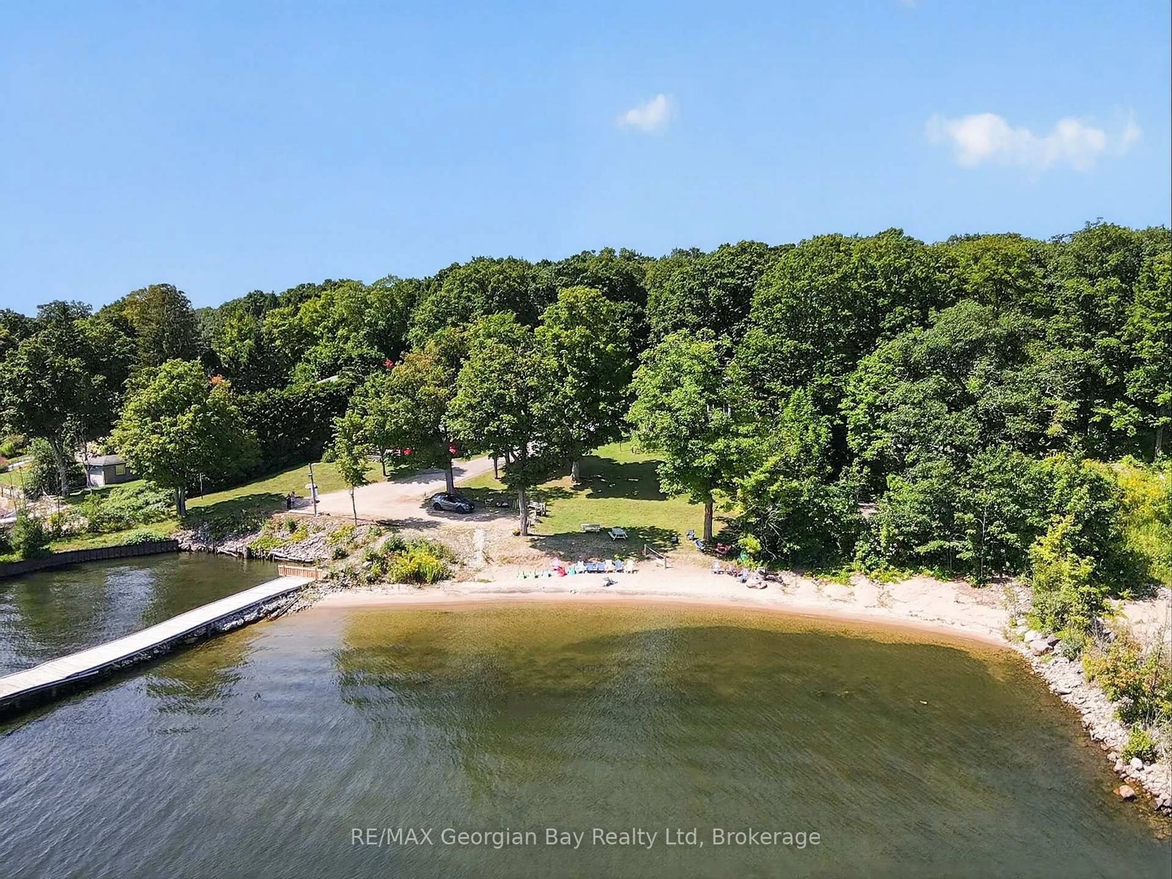 A pic from outside/outdoor area/front of a property/back of a property/a pic from drone, water/lake/river/ocean view for 525 Midland Point Rd #33, Midland Ontario L4R 5G9