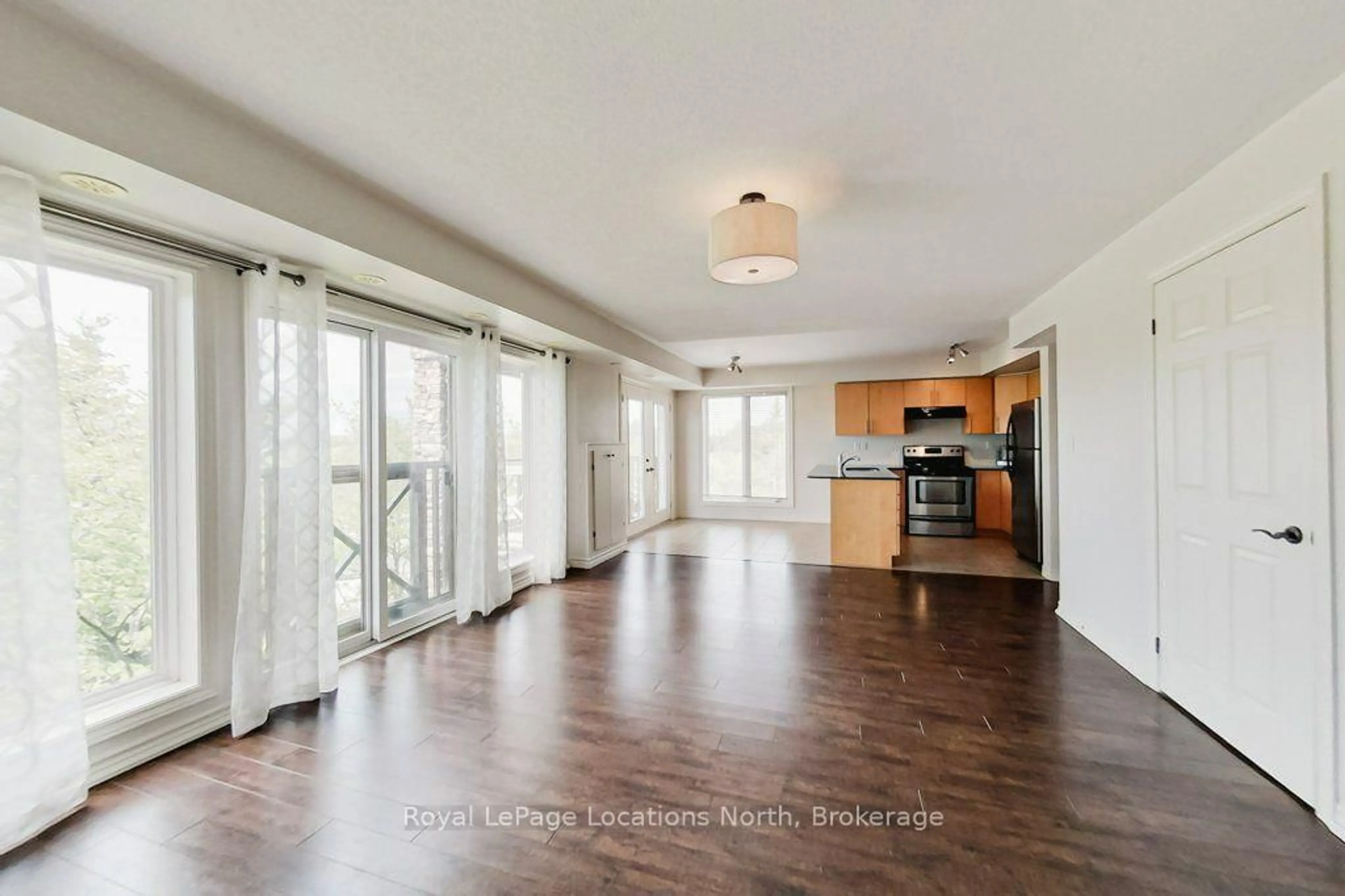 Open concept kitchen, wood/laminate floor for 2 Joseph Tr, Collingwood Ontario L9Y 0J2