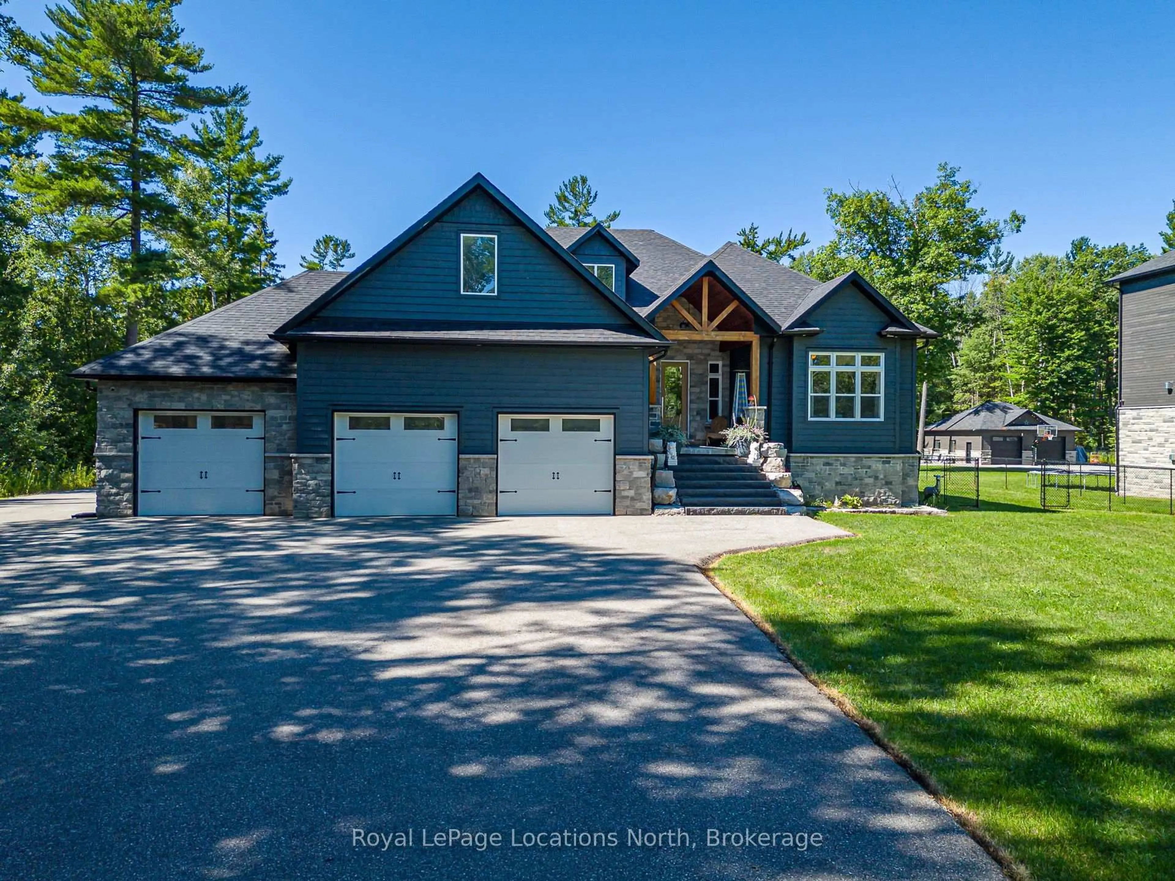 Home with brick exterior material, street for 26 Spruce St, Tiny Ontario L0L 1P1