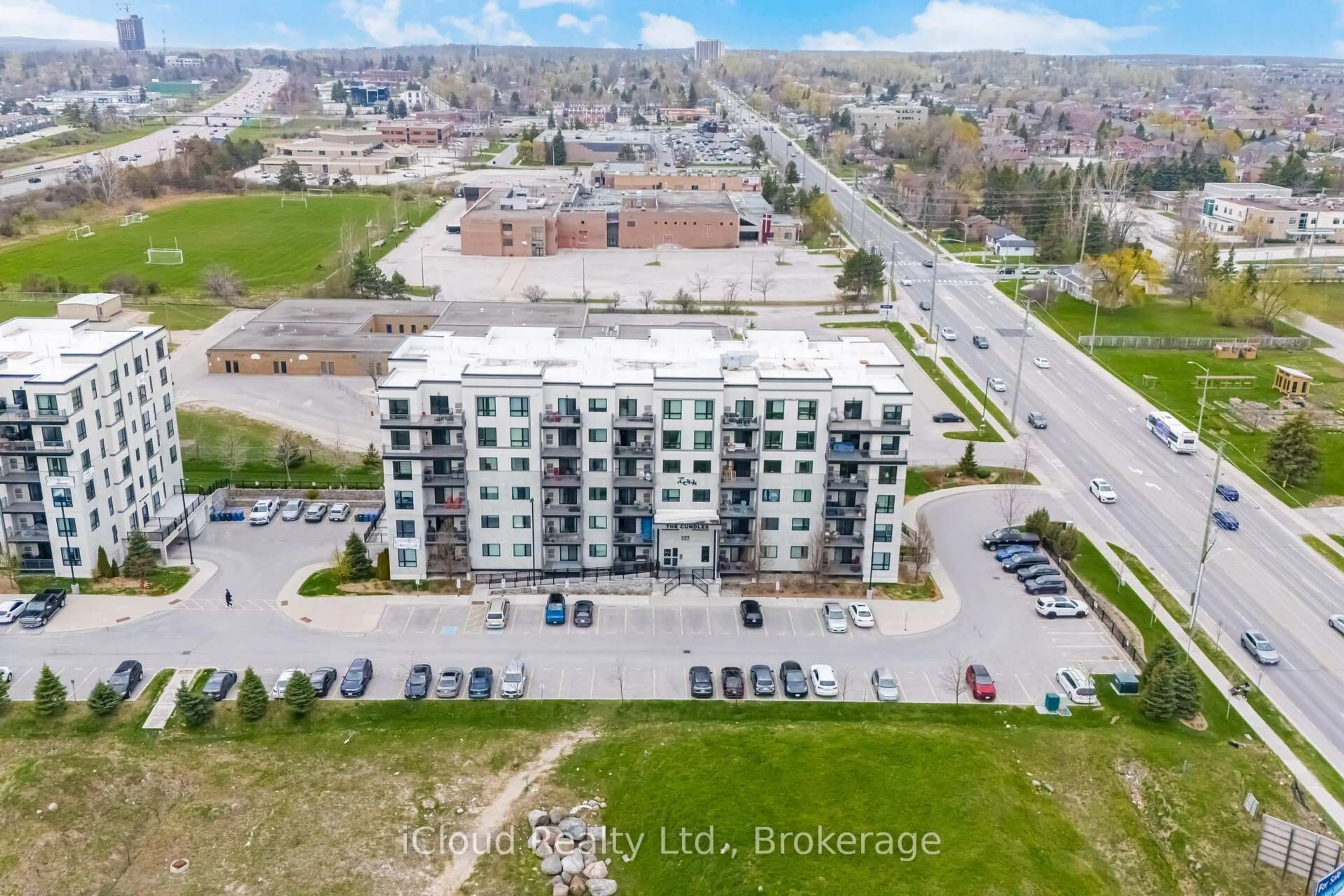 A pic from outside/outdoor area/front of a property/back of a property/a pic from drone, unknown for 295 Cundles Rd #208, Barrie Ontario L4M 0K8