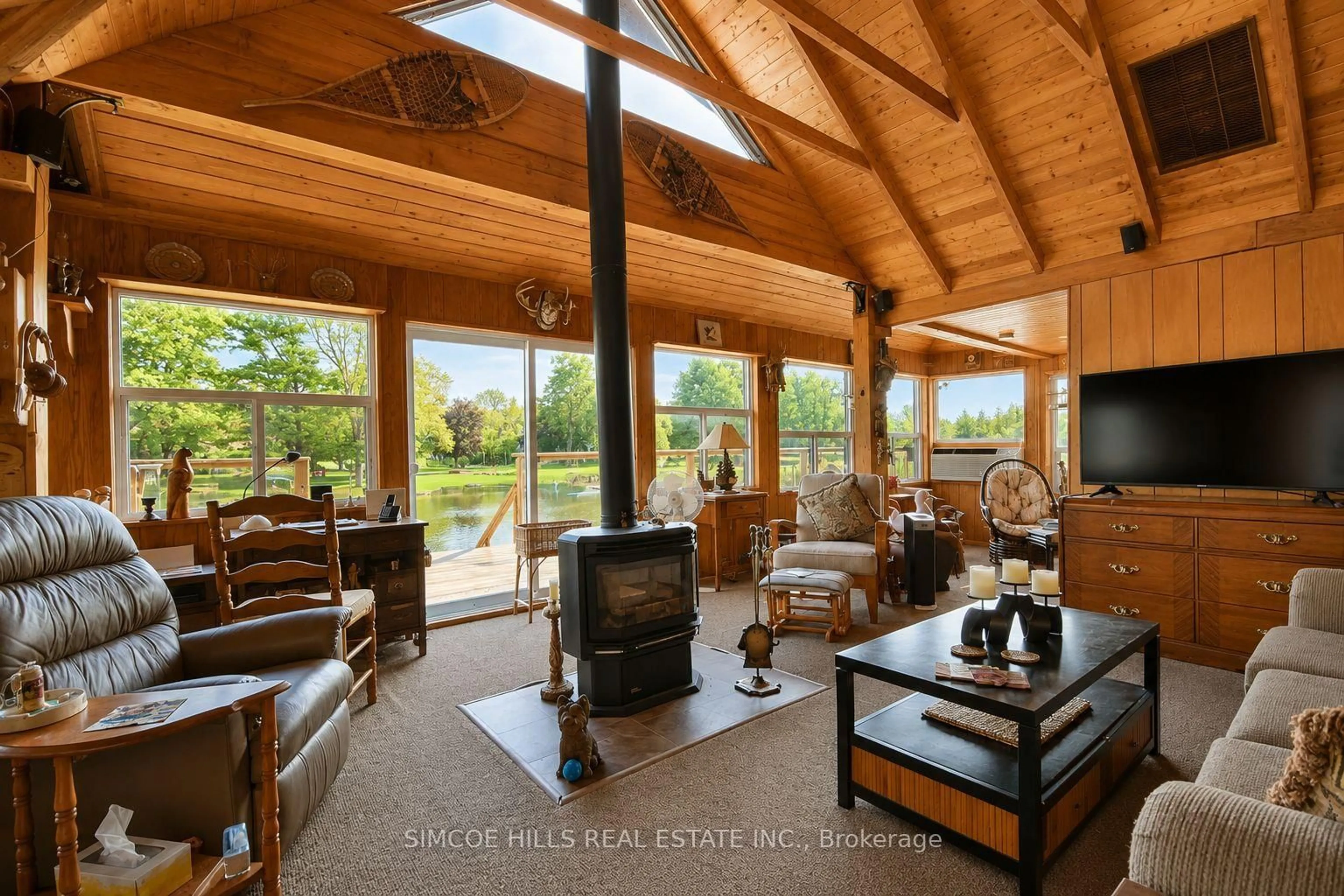 Living room with furniture, wood/laminate floor for 4266 Canal Rd, Severn Ontario L0K 2B0