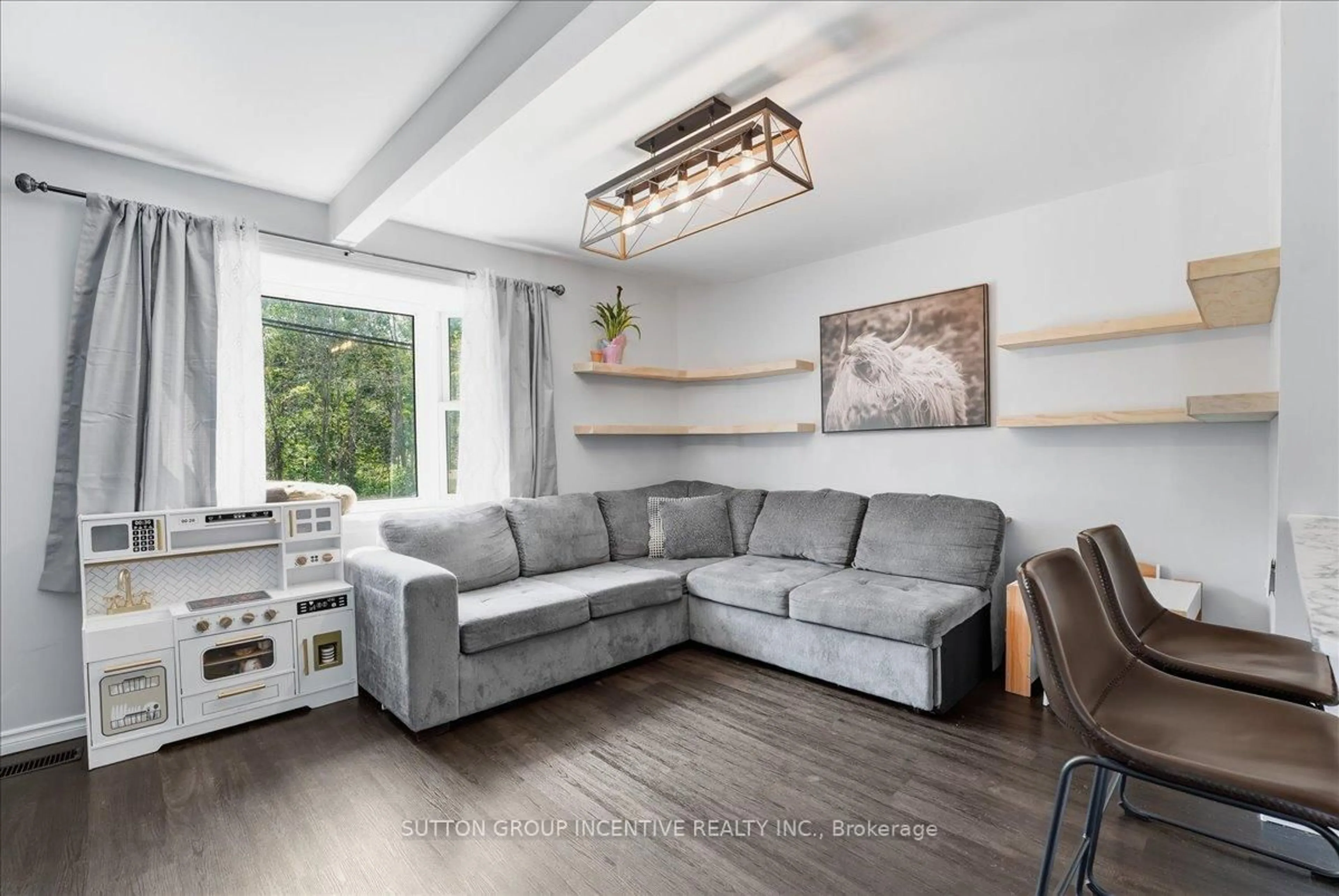 Living room with furniture, wood/laminate floor for 107 Park St, Tay Ontario L0K 2A0