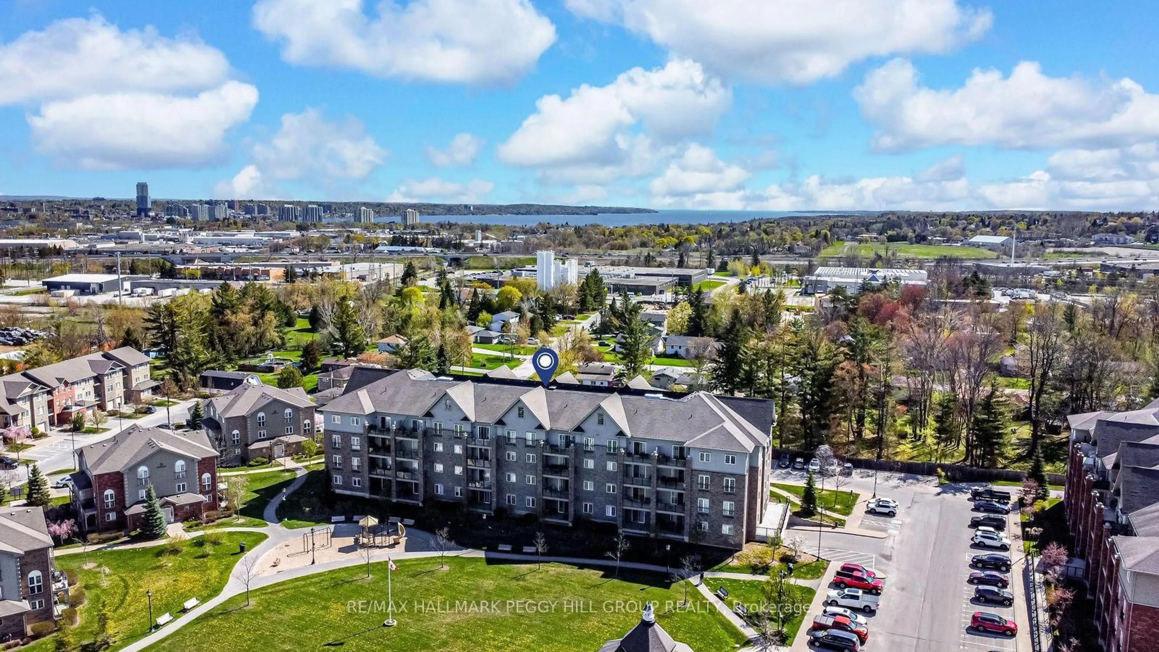 A pic from outside/outdoor area/front of a property/back of a property/a pic from drone, water/lake/river/ocean view for 45 Ferndale Dr #305, Barrie Ontario L4N 5W7