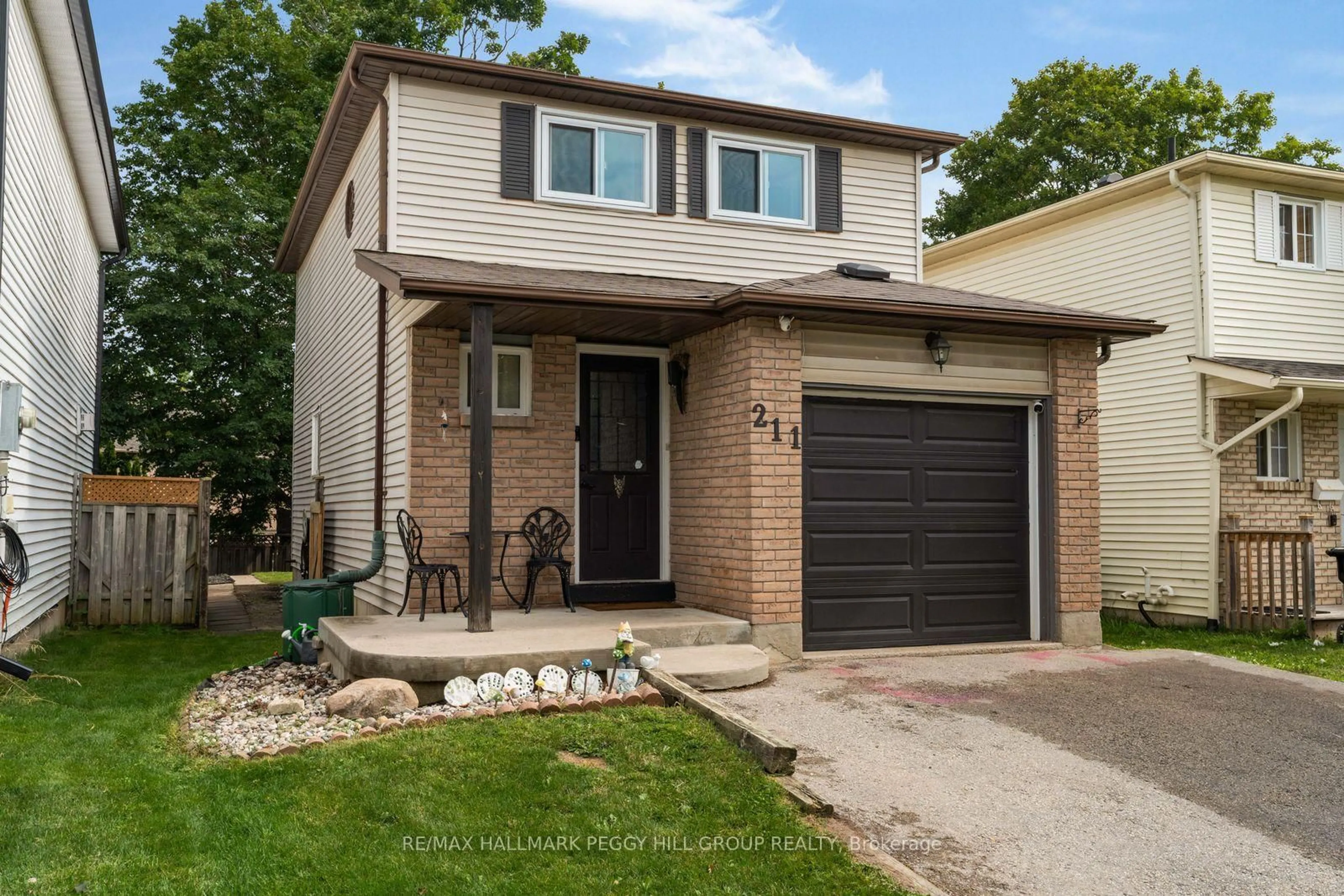 Home with brick exterior material, street for 211 Hickling Tr, Barrie Ontario L4M 5W6