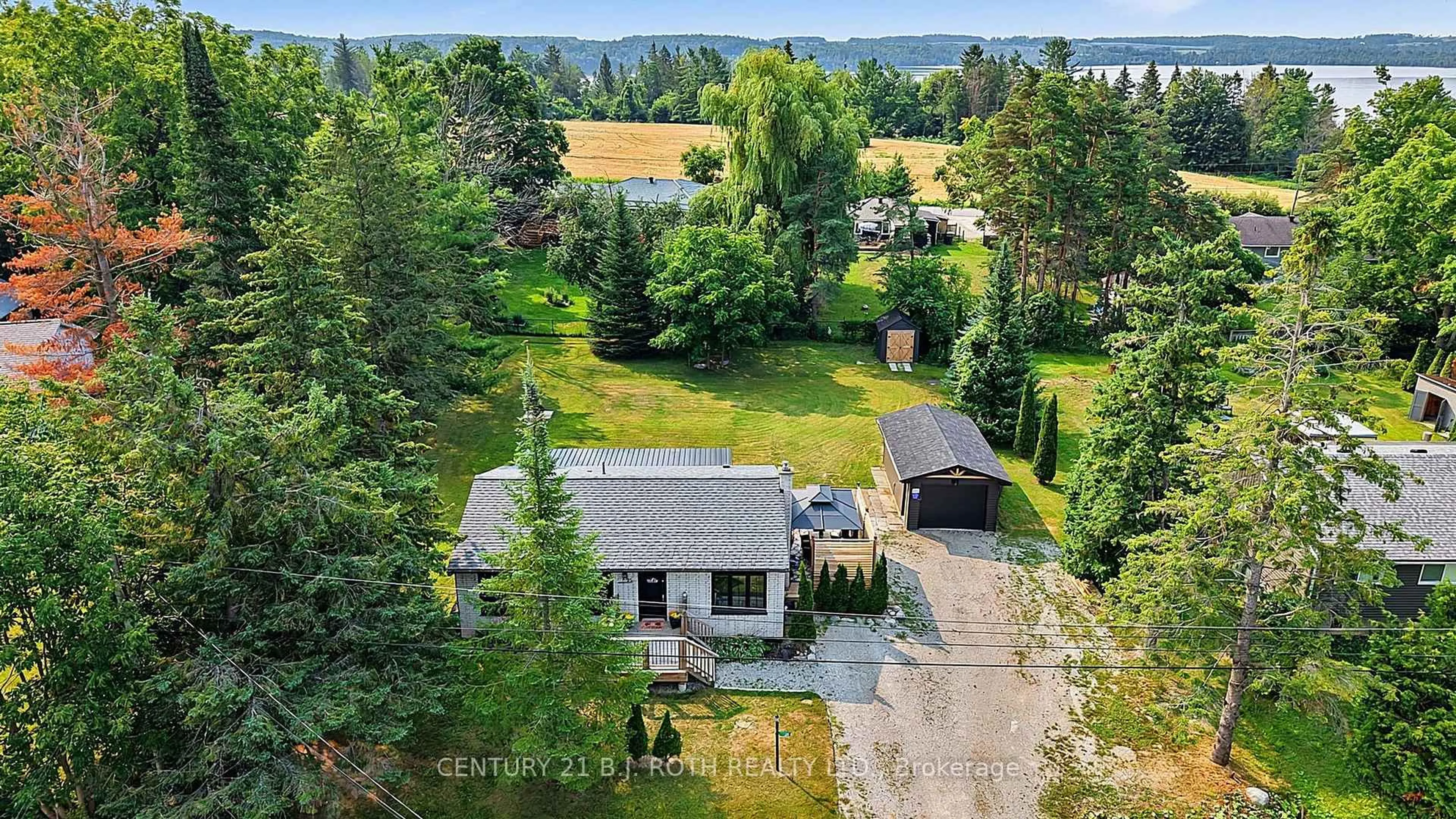 A pic from outside/outdoor area/front of a property/back of a property/a pic from drone, water/lake/river/ocean view for 25 Glengrove Ave, Oro-Medonte Ontario L3V 0J9