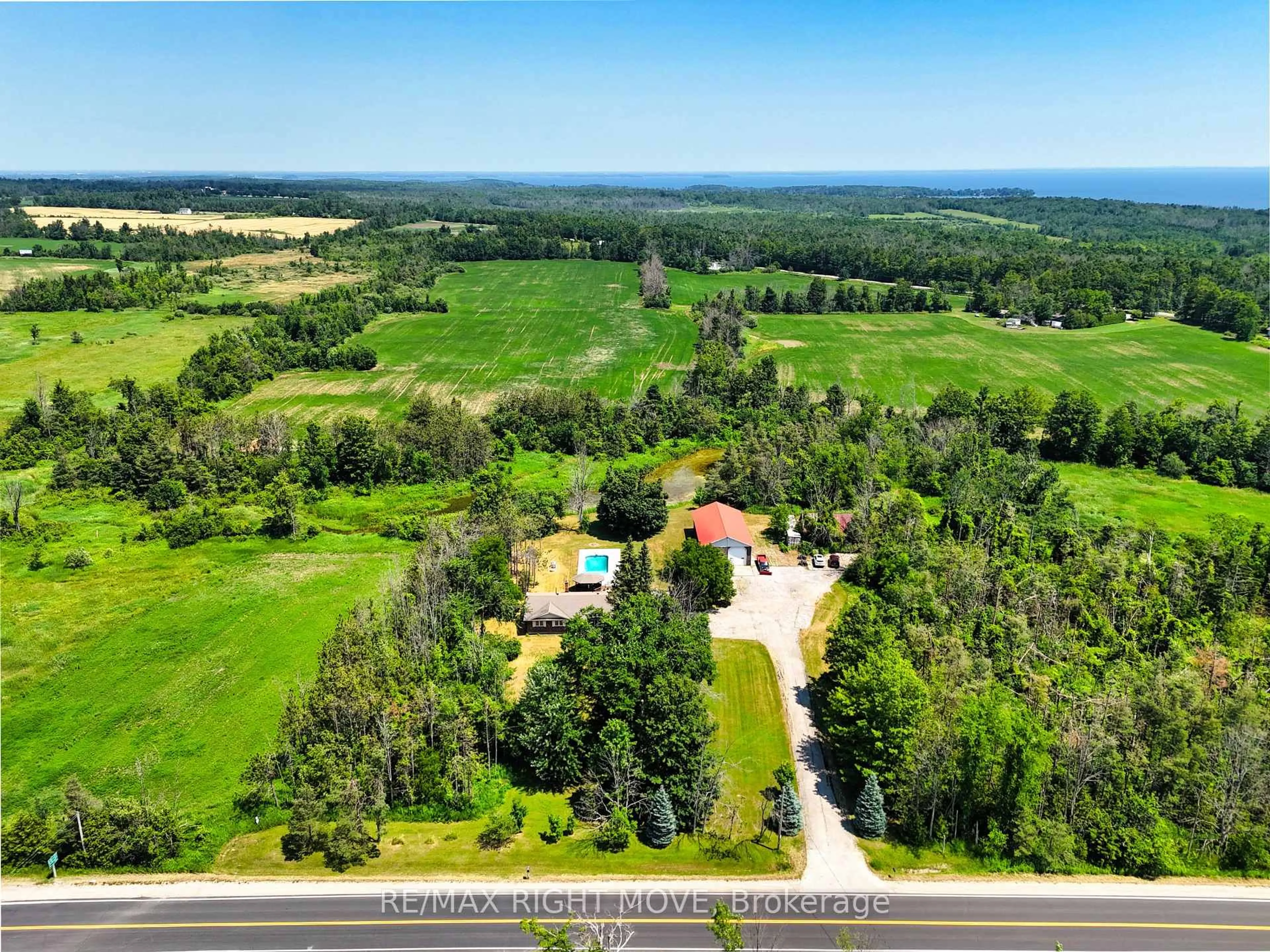 A pic from outside/outdoor area/front of a property/back of a property/a pic from drone, water/lake/river/ocean view for 114 11th Line, Oro-Medonte Ontario L0L 1T0