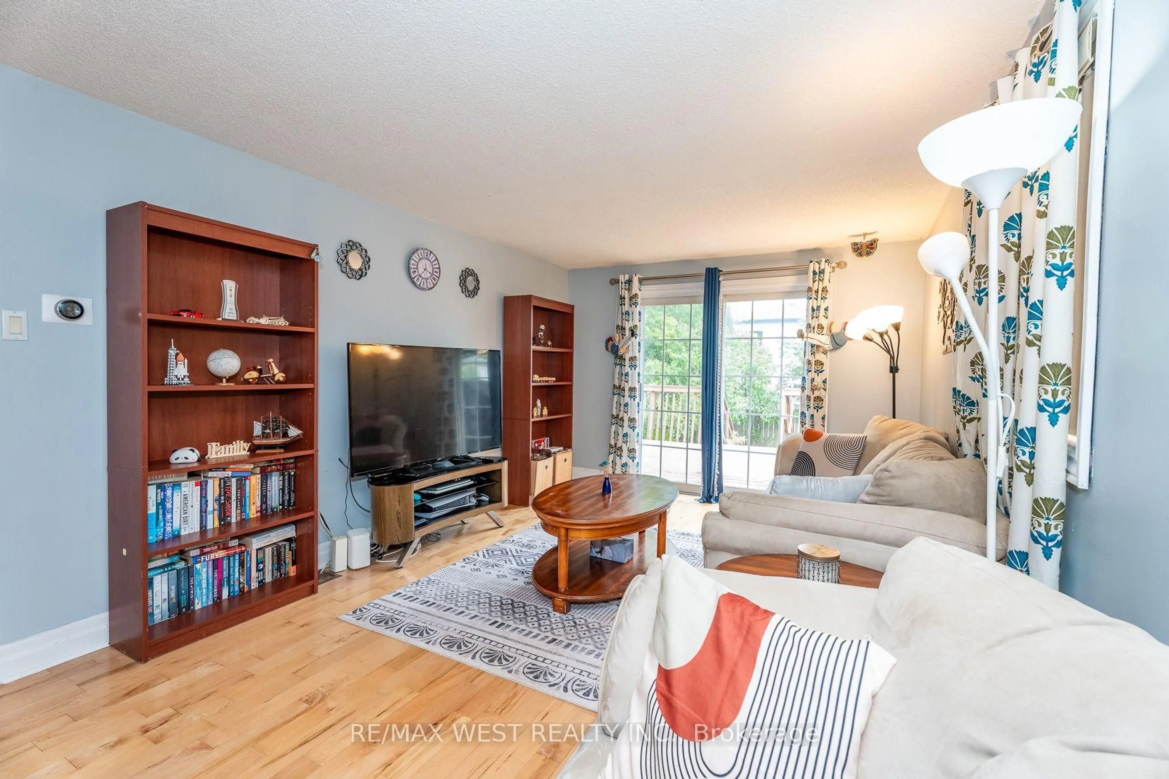 Living room with furniture, wood/laminate floor for 369 Galloway Blvd, Midland Ontario L4R 5C1
