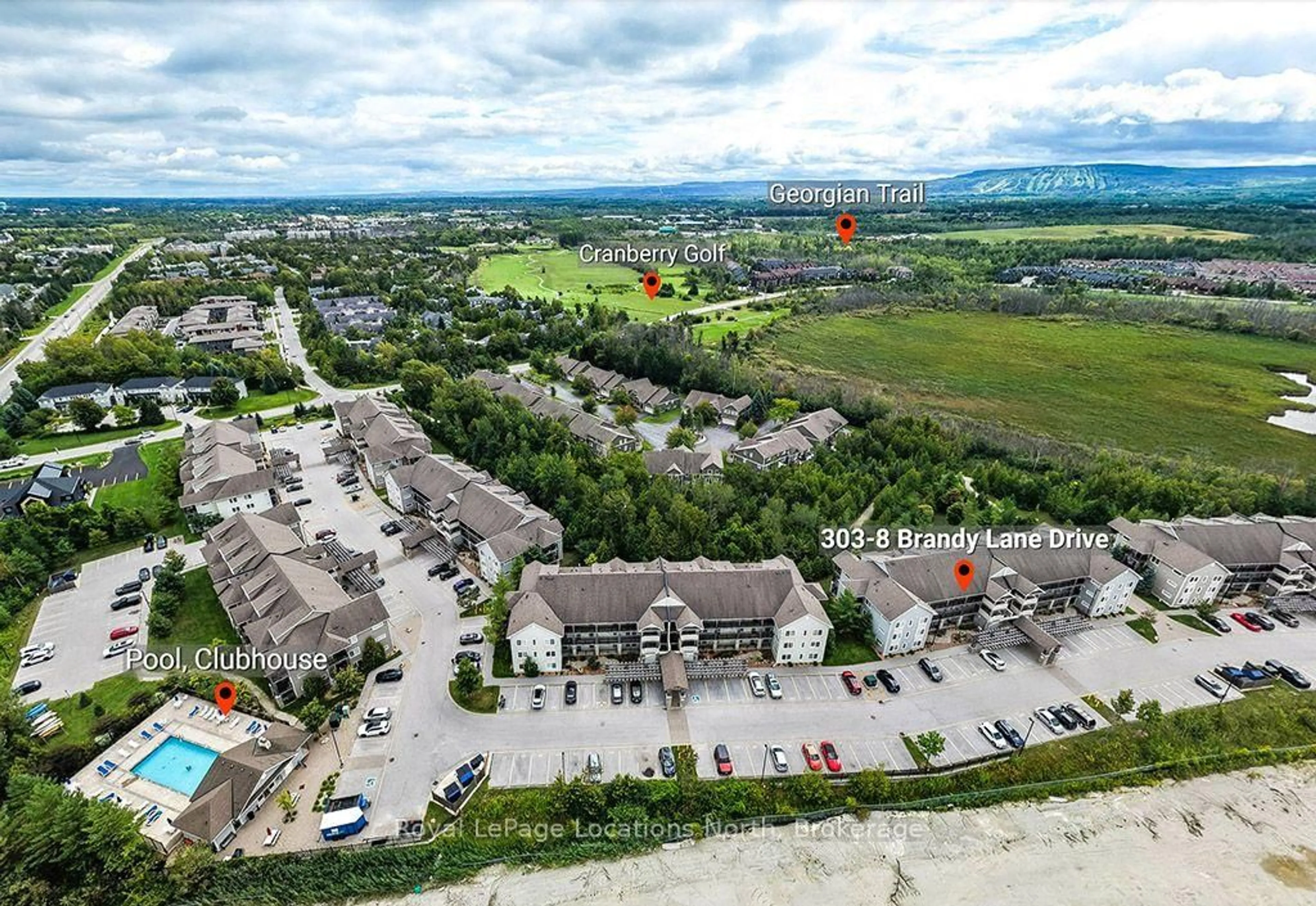 A pic from outside/outdoor area/front of a property/back of a property/a pic from drone, unknown for 8 Brandy Lane Dr #303, Collingwood Ontario L9Y 0X4