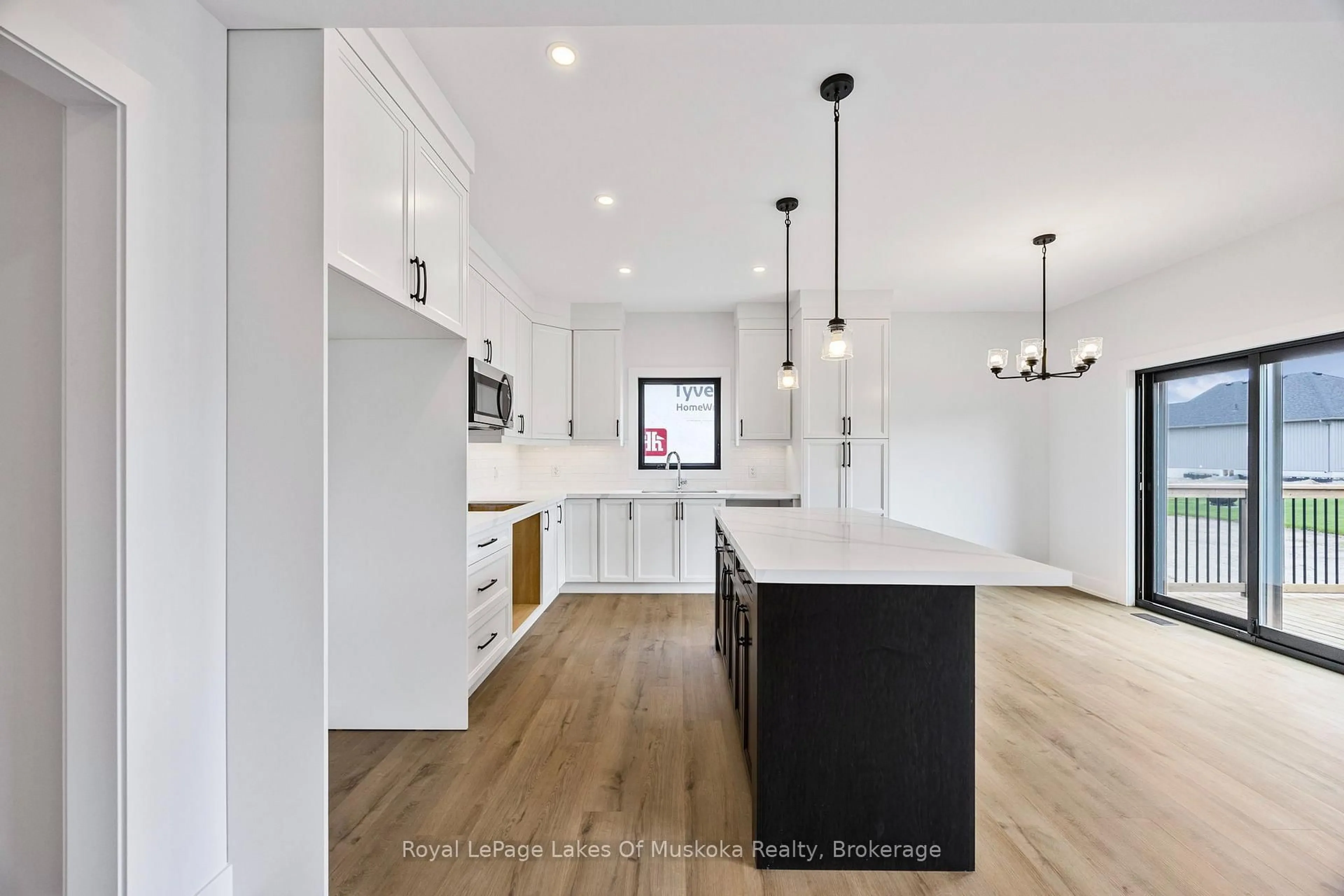 Open concept kitchen, wood/laminate floor for 37 Harold Ave, Severn Ontario L0K 1E0