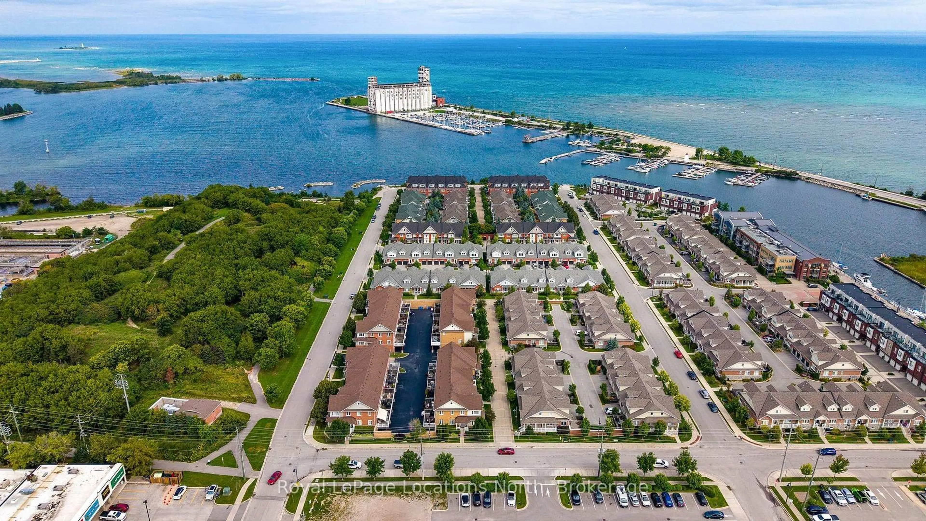 A pic from outside/outdoor area/front of a property/back of a property/a pic from drone, water/lake/river/ocean view for 35 SIDE LAUNCH Way, Collingwood Ontario L9Y 0J9
