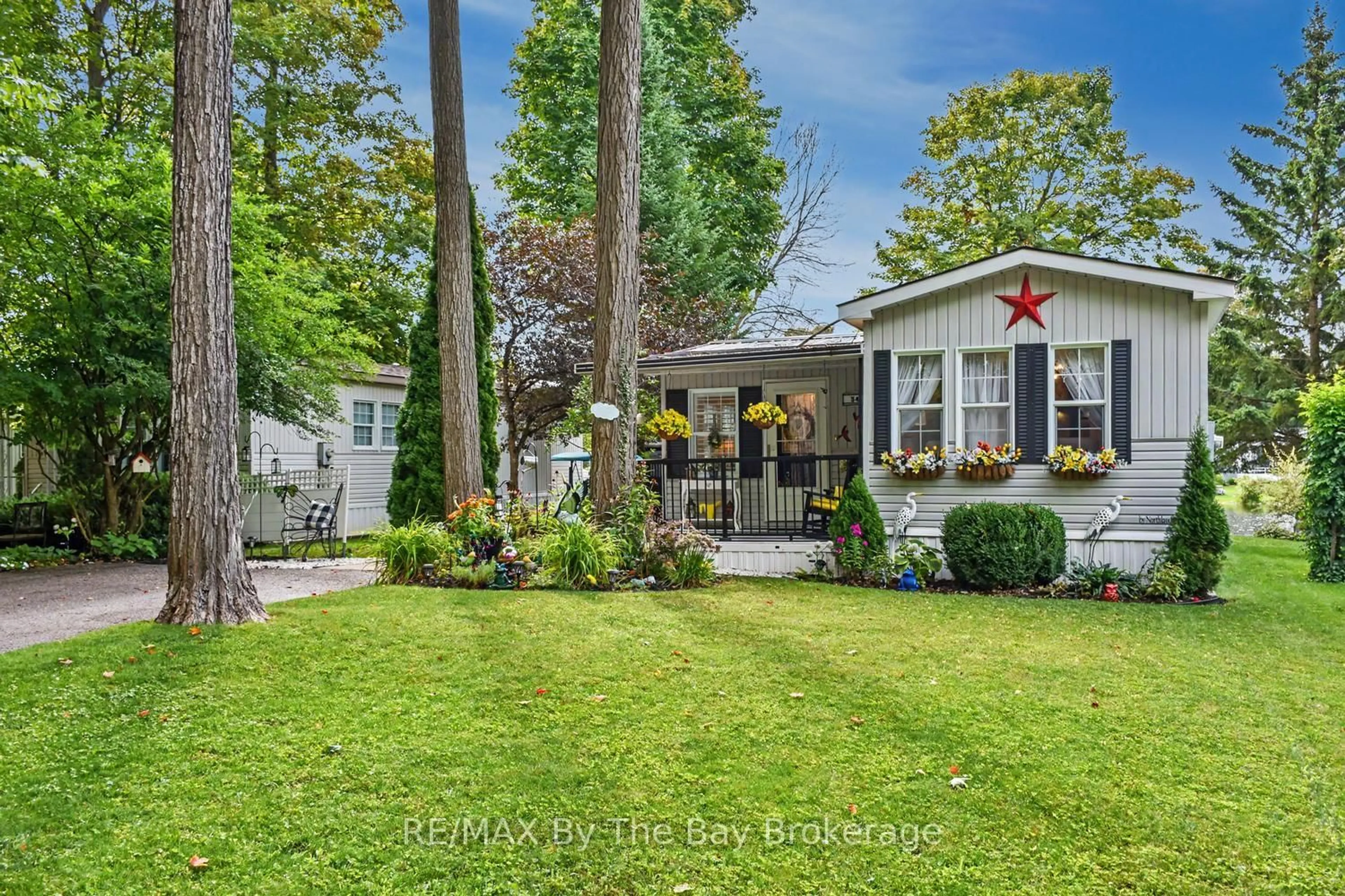 A pic from outside/outdoor area/front of a property/back of a property/a pic from drone, street for 54 The Board Walk, Wasaga Beach Ontario L9Z 3A8