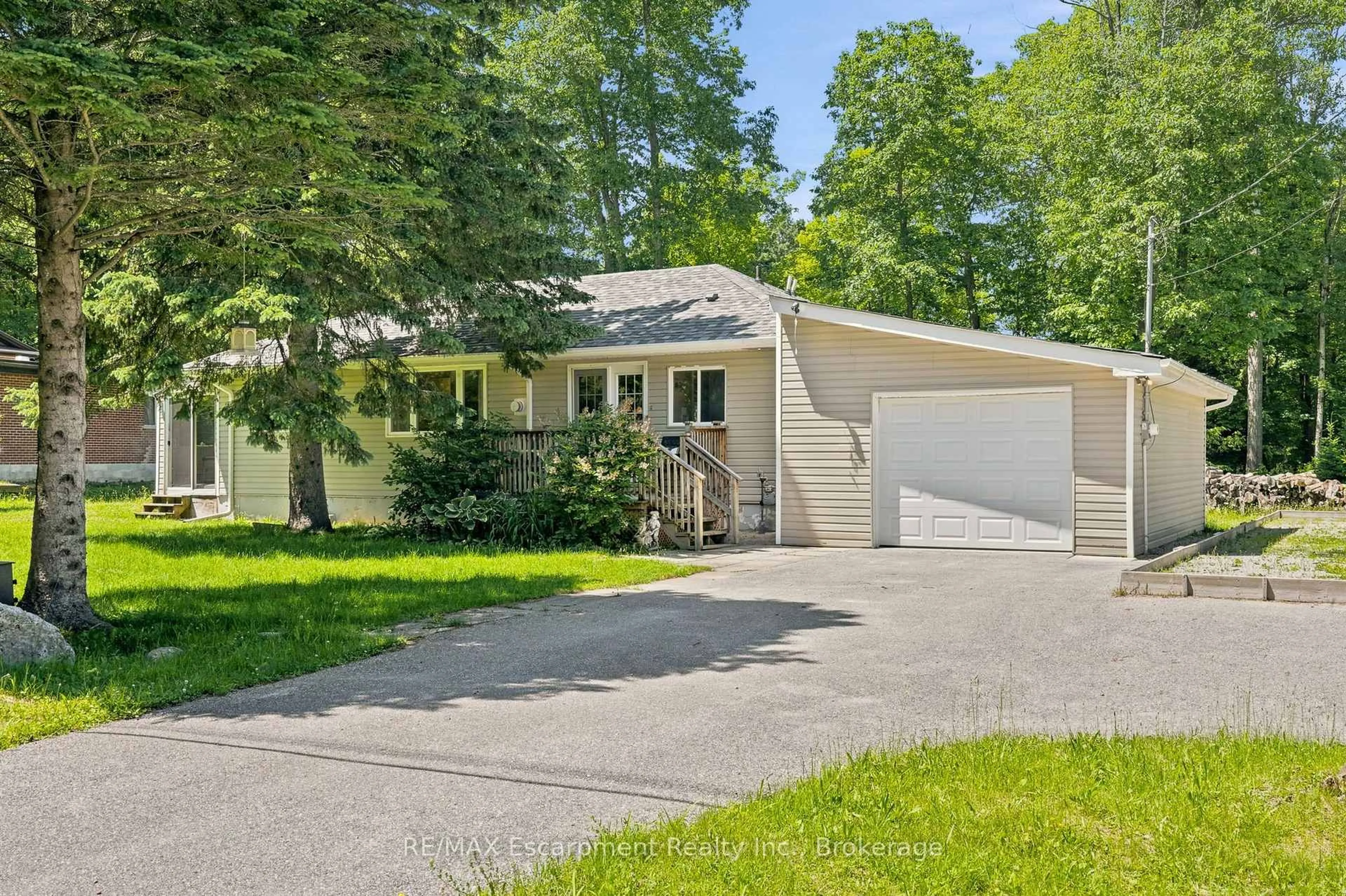 Home with vinyl exterior material, street for 16 Hiawatha Rd, Tiny Ontario L9M 0B1