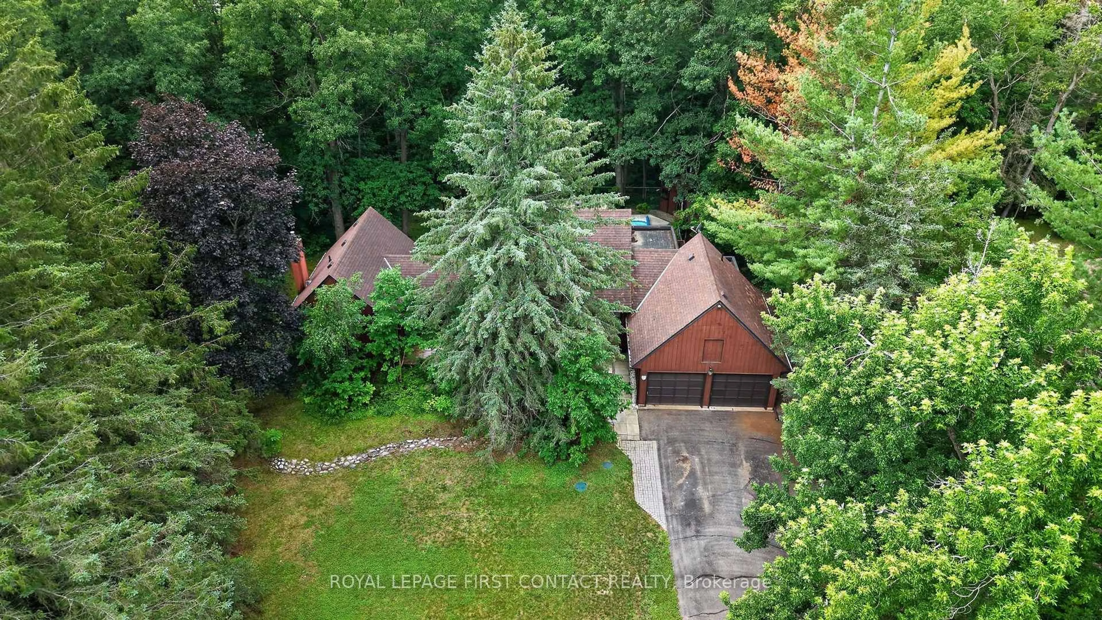 A pic from outside/outdoor area/front of a property/back of a property/a pic from drone, forest/trees view for 29 Doran Rd, Springwater Ontario L9X 1L3