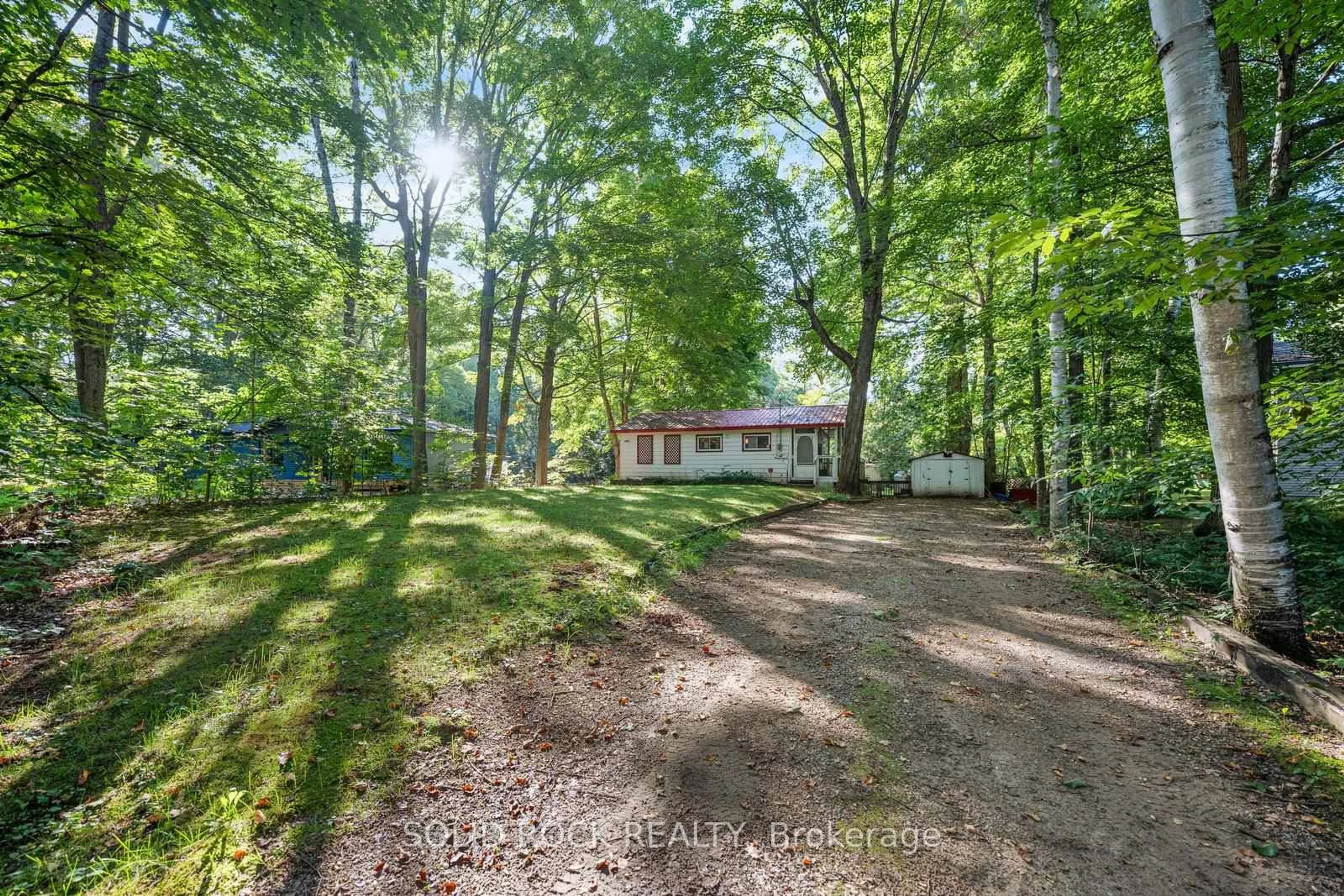 A pic from outside/outdoor area/front of a property/back of a property/a pic from drone, forest/trees view for 7465 East River Rd, Ramara Ontario L0K 2B0
