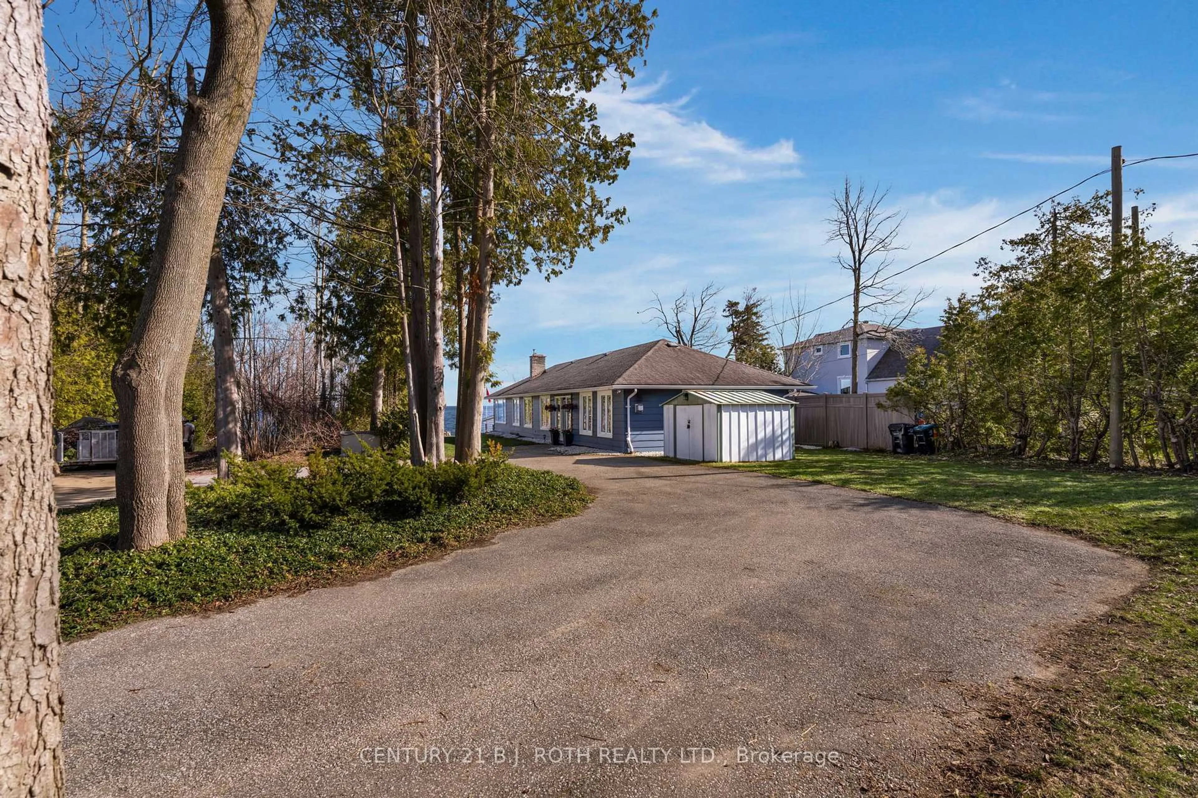 A pic from outside/outdoor area/front of a property/back of a property/a pic from drone, unknown for 49 Lakeshore Rd, Oro-Medonte Ontario L0L 2E0