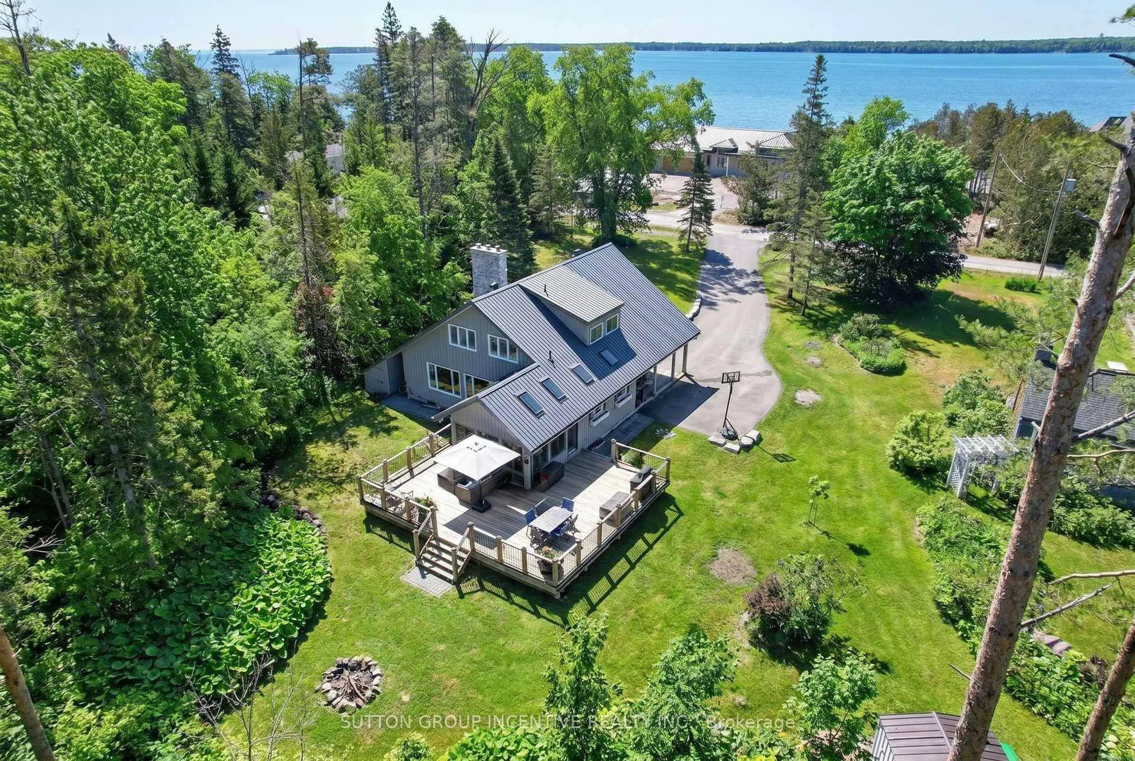 A pic from outside/outdoor area/front of a property/back of a property/a pic from drone, water/lake/river/ocean view for 24 Brambel Rd, Oro-Medonte Ontario L0L 2L0