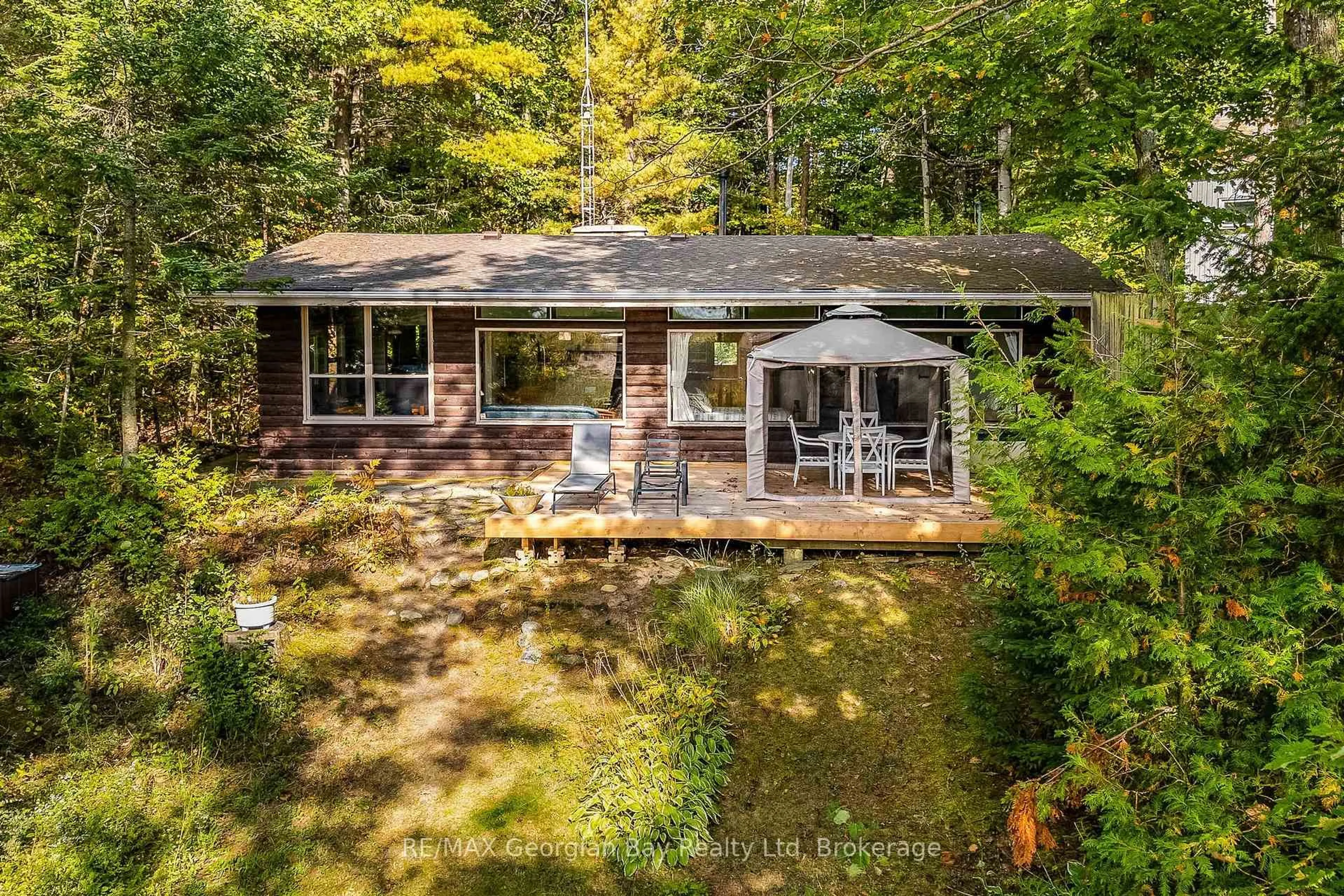 A pic from outside/outdoor area/front of a property/back of a property/a pic from drone, forest/trees view for 100 Nottawaga Dr, Tiny Ontario L0L 2J0