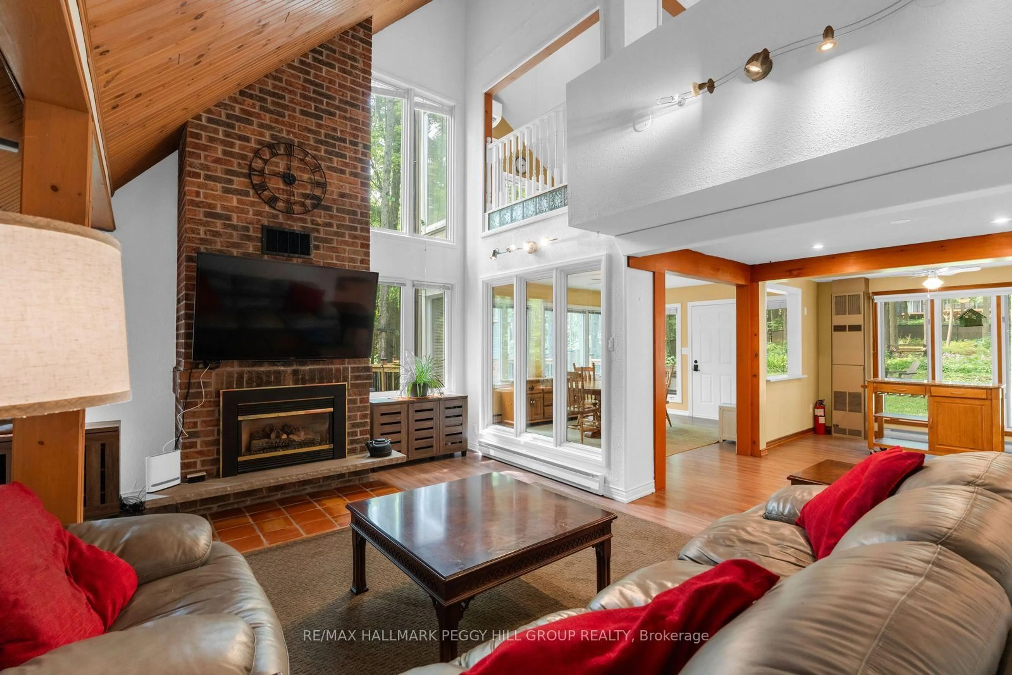 Living room with furniture, wood/laminate floor for 6 Slalom Dr, Oro-Medonte Ontario L0K 1N0