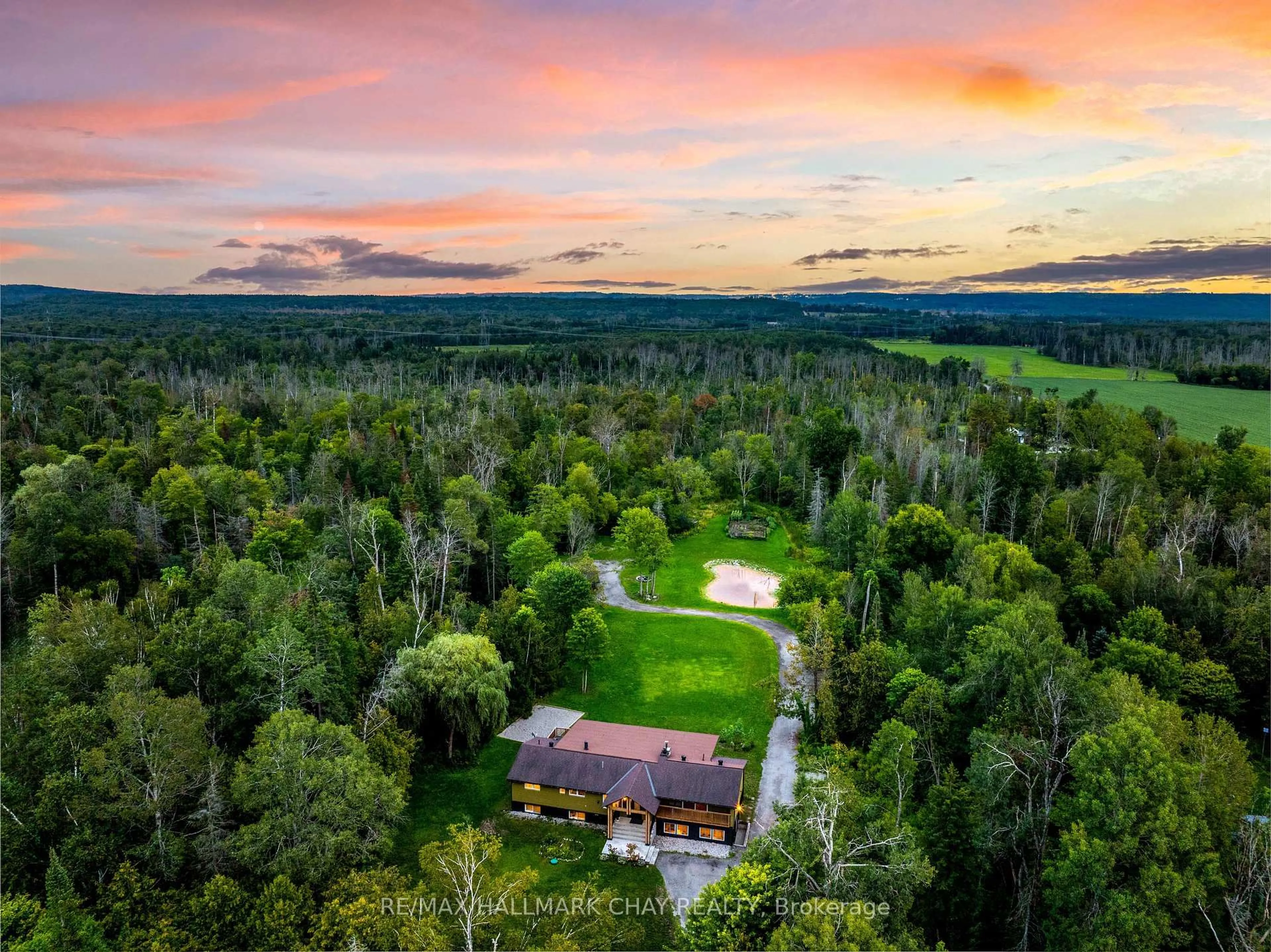 A pic from outside/outdoor area/front of a property/back of a property/a pic from drone, forest/trees view for 1507 Hendrie Rd, Springwater Ontario L0L 1Y2
