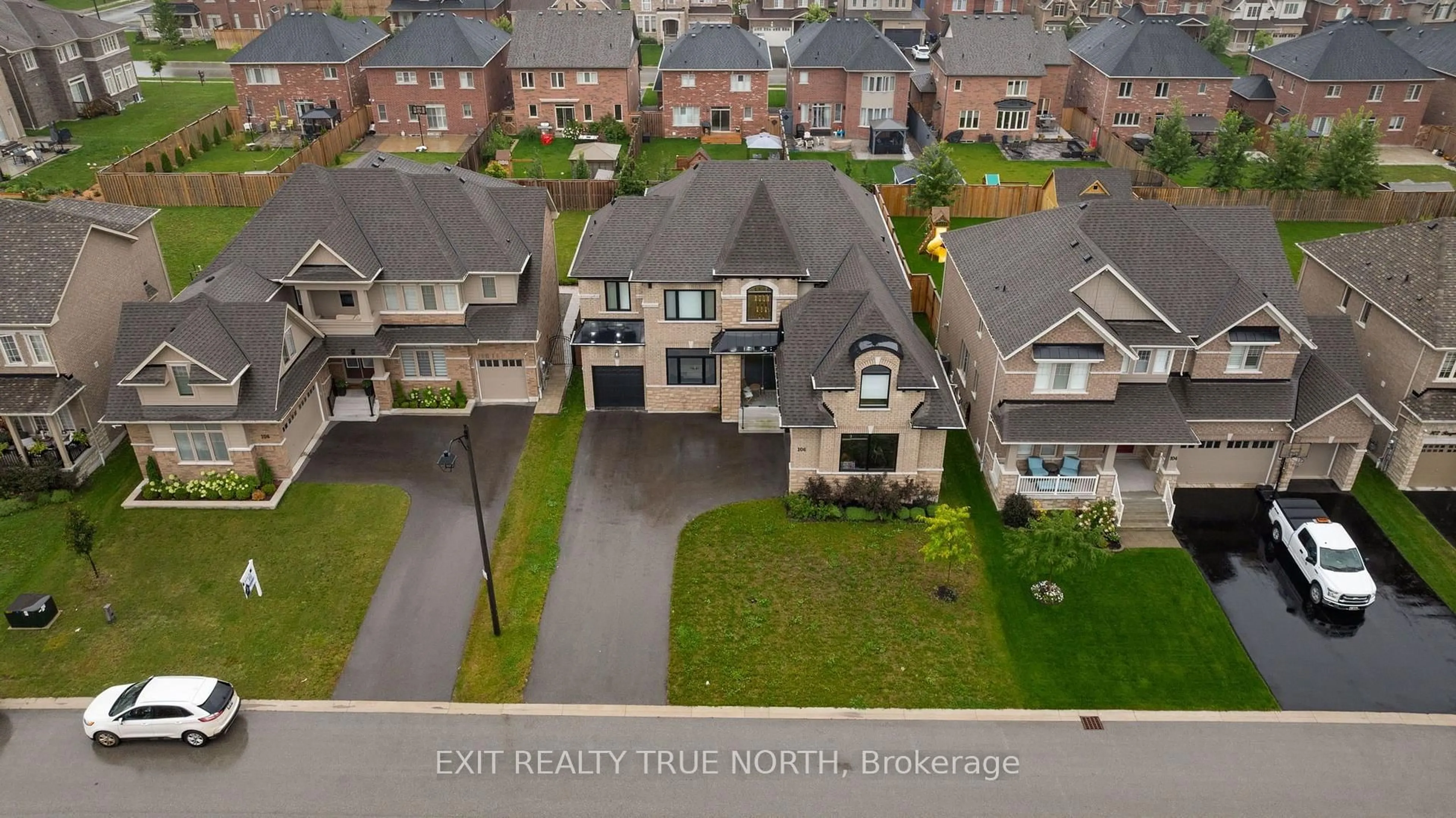 A pic from outside/outdoor area/front of a property/back of a property/a pic from drone, street for 106 Rugman Cres, Springwater Ontario L9X 2A5