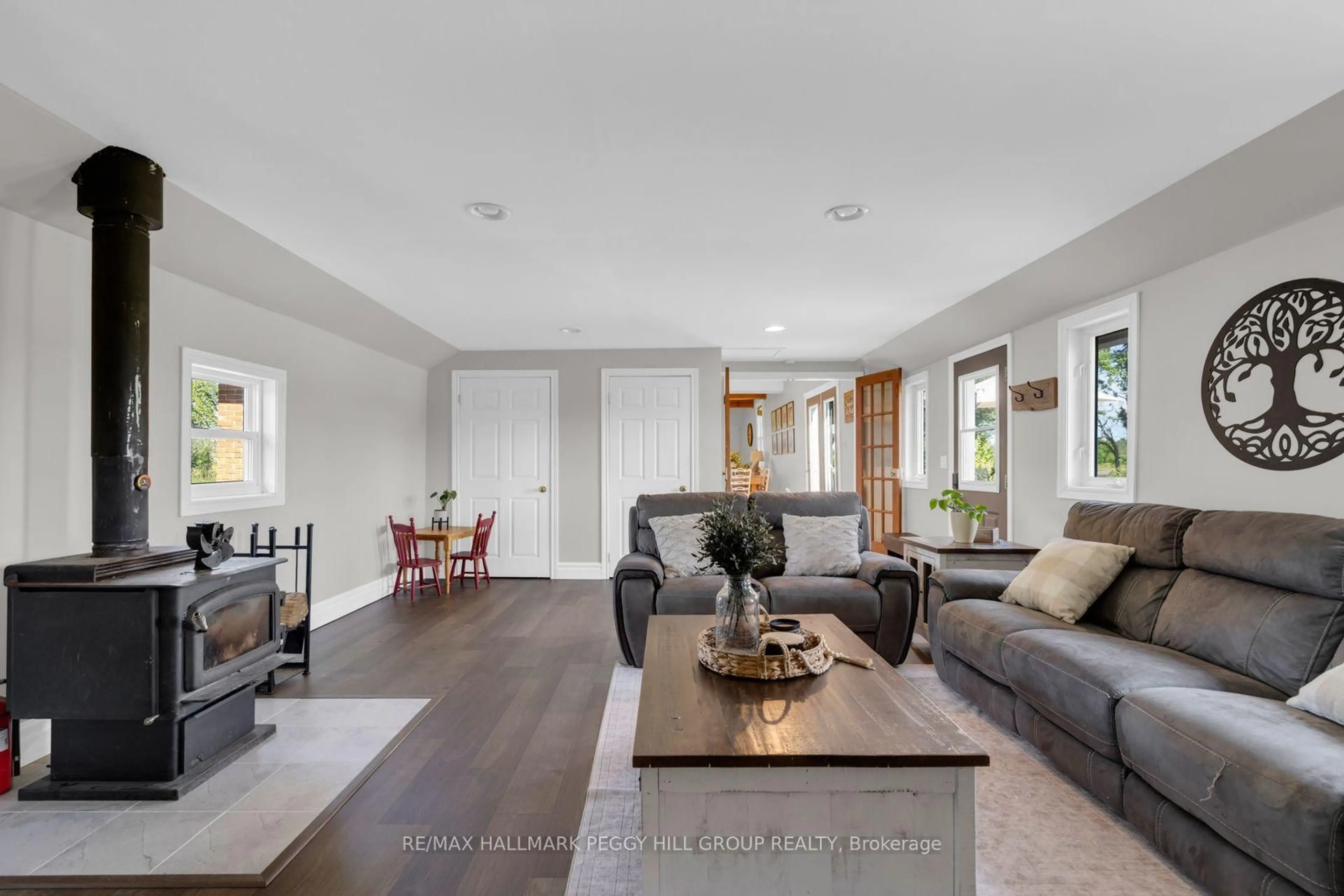 Living room with furniture, unknown for 4295 Horseshoe Valley Rd, Springwater Ontario L9X 1G1