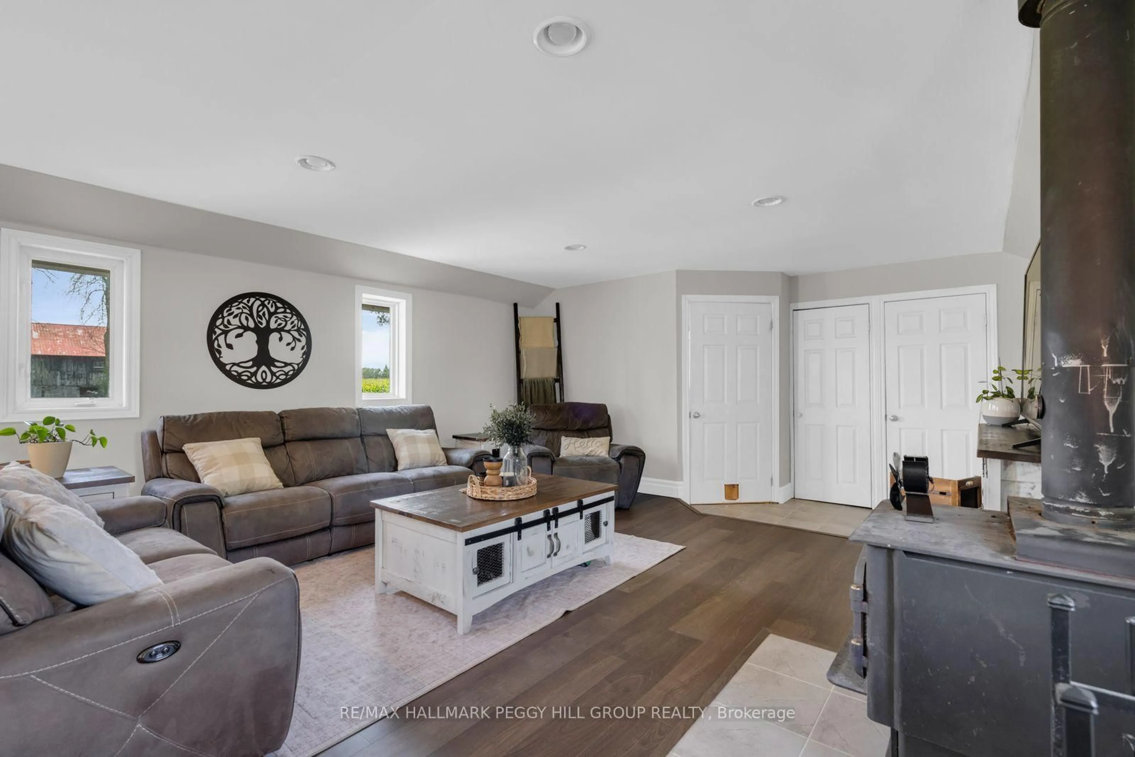 Living room with furniture, unknown for 4295 Horseshoe Valley Rd, Springwater Ontario L9X 1G1