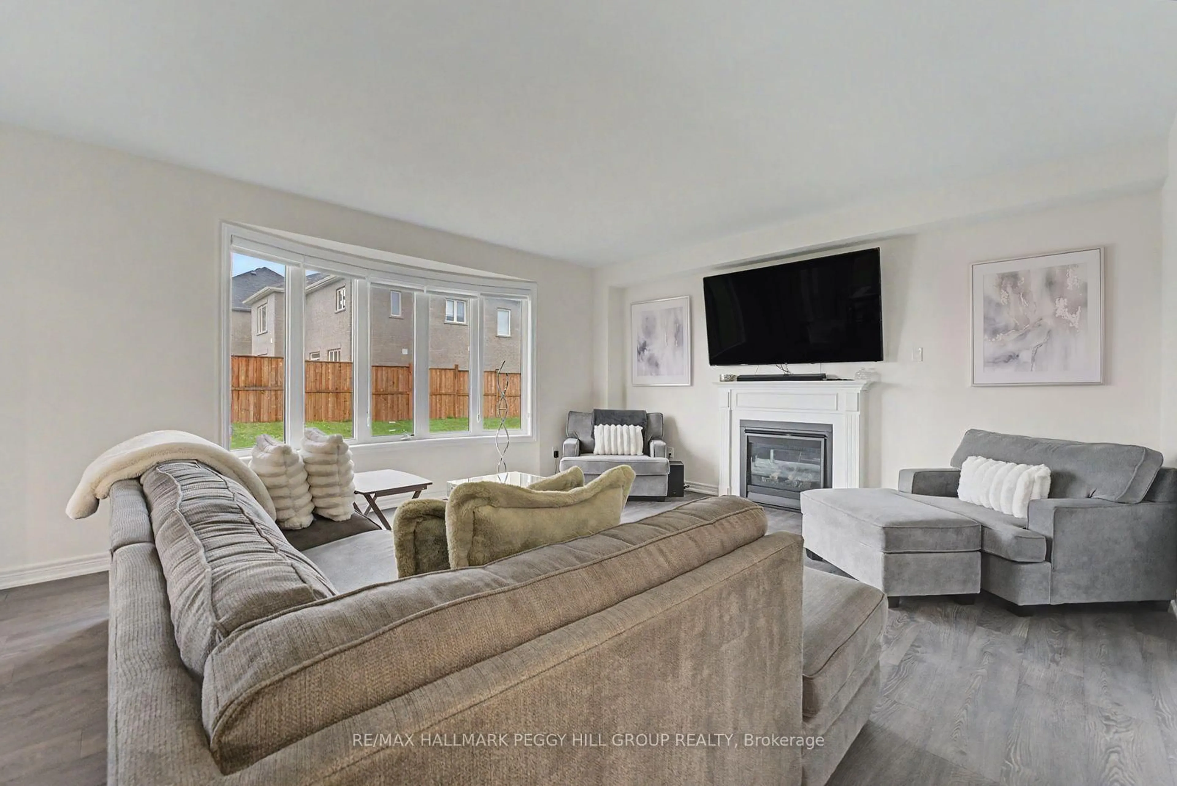 Living room with furniture, unknown for 113 Rugman Cres, Springwater Ontario L9X 2A5
