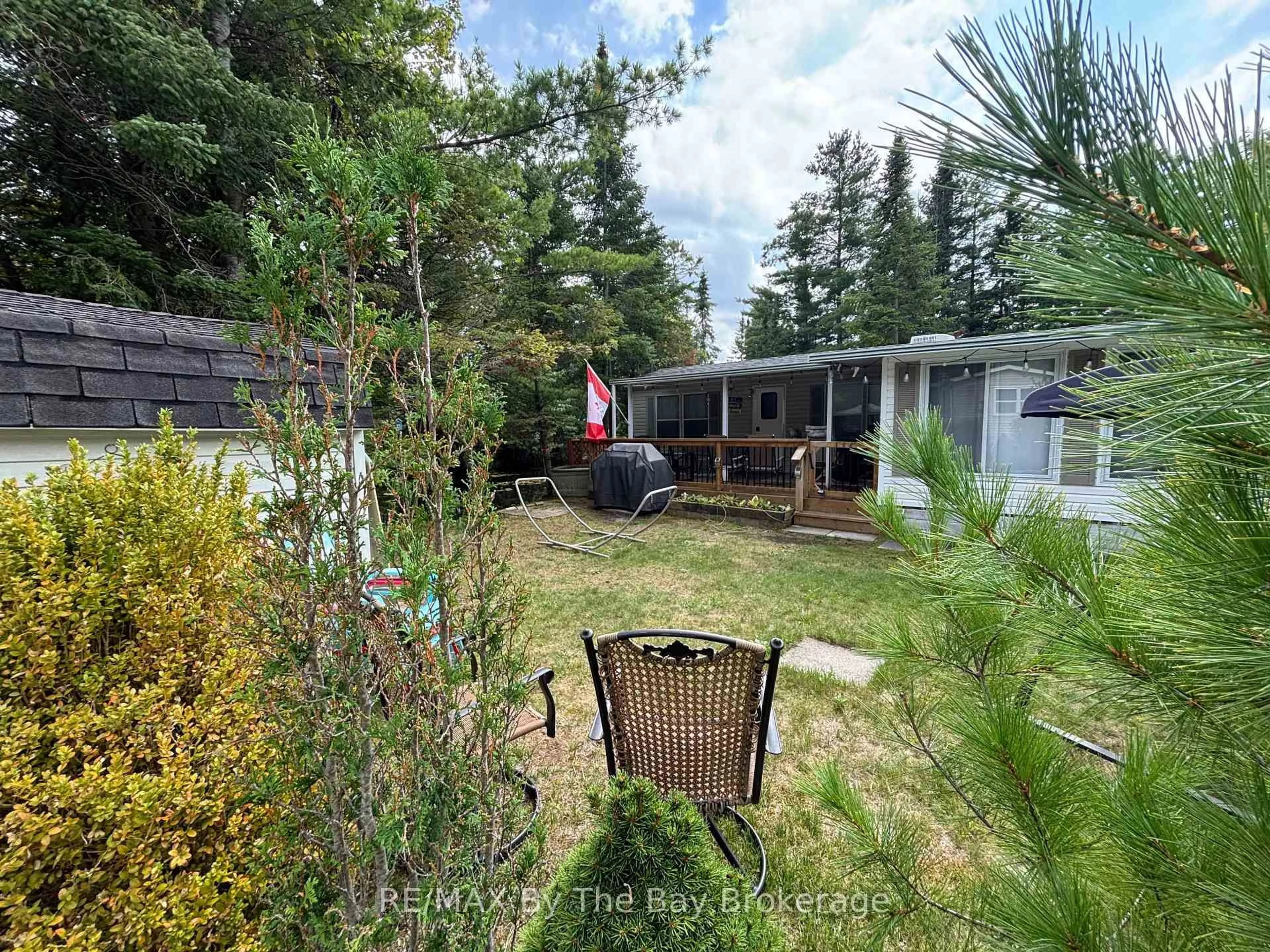 A pic from outside/outdoor area/front of a property/back of a property/a pic from drone, forest/trees view for 85 THEME PARK Dr #168, Wasaga Beach Ontario L9Z 1X7