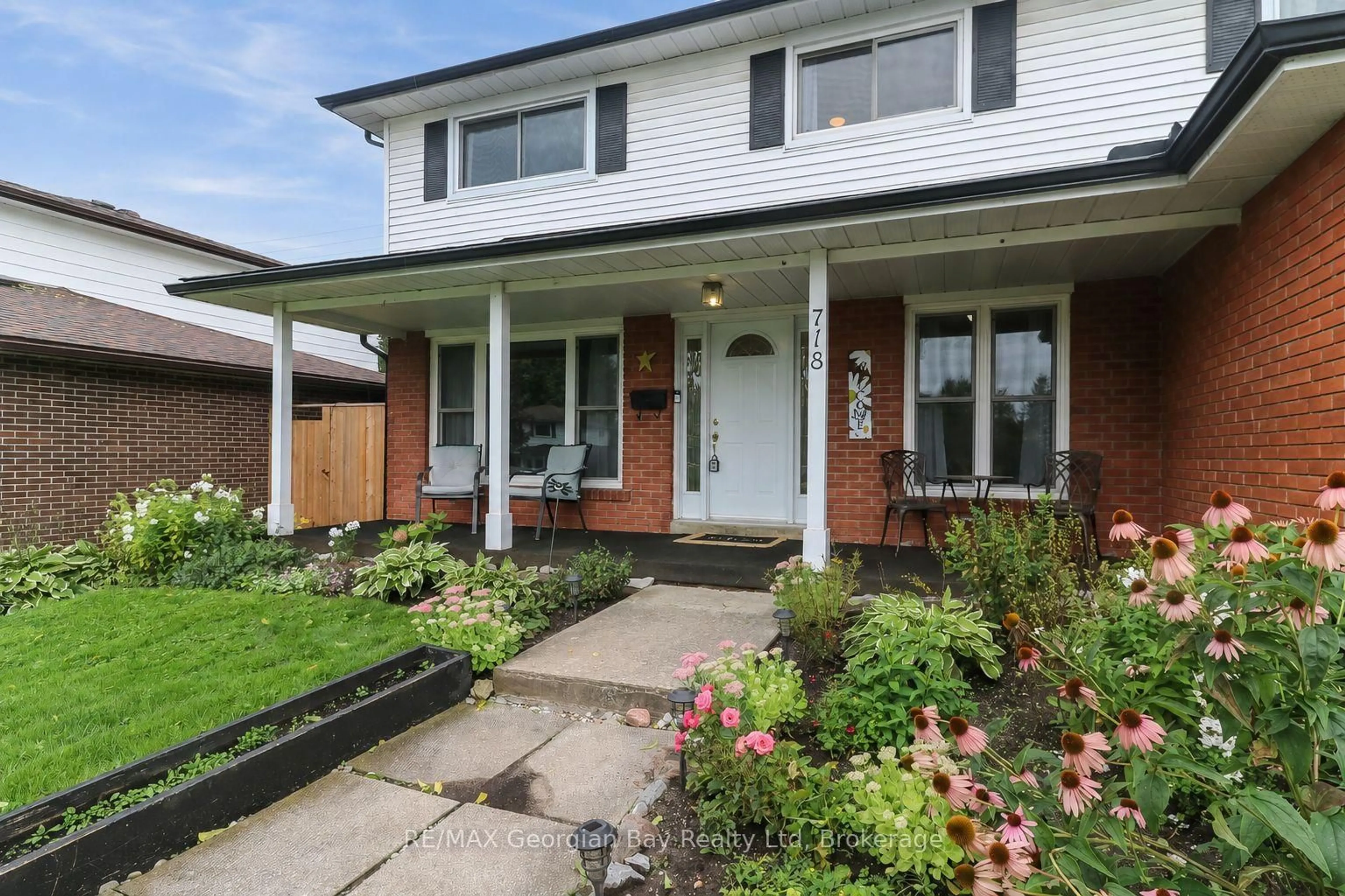 Home with brick exterior material, street for 718 Birchwood Dr, Midland Ontario L4R 2P7