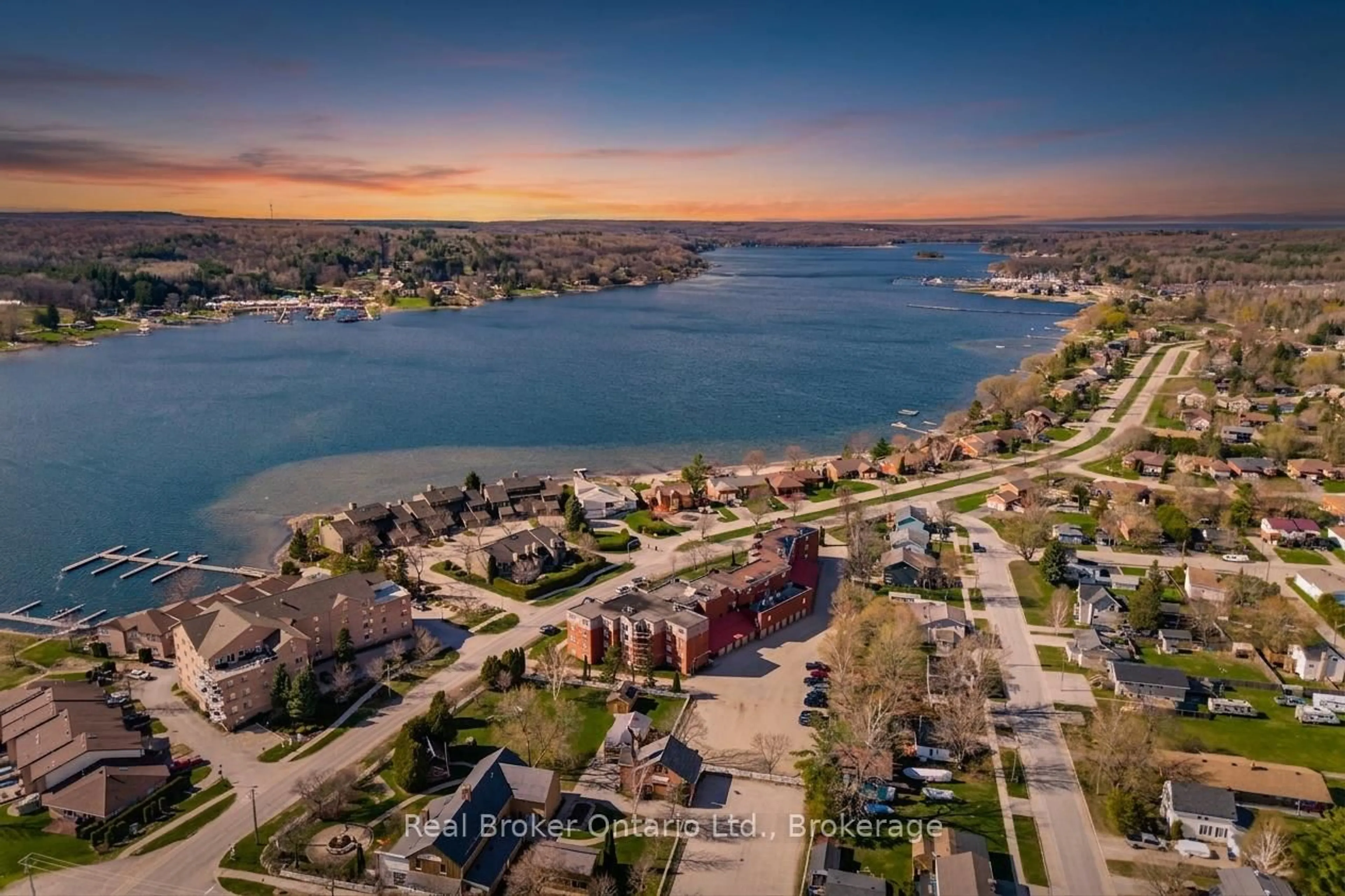A pic from outside/outdoor area/front of a property/back of a property/a pic from drone, water/lake/river/ocean view for 11 Beck Blvd #402, Penetanguishene Ontario L9M 2G1