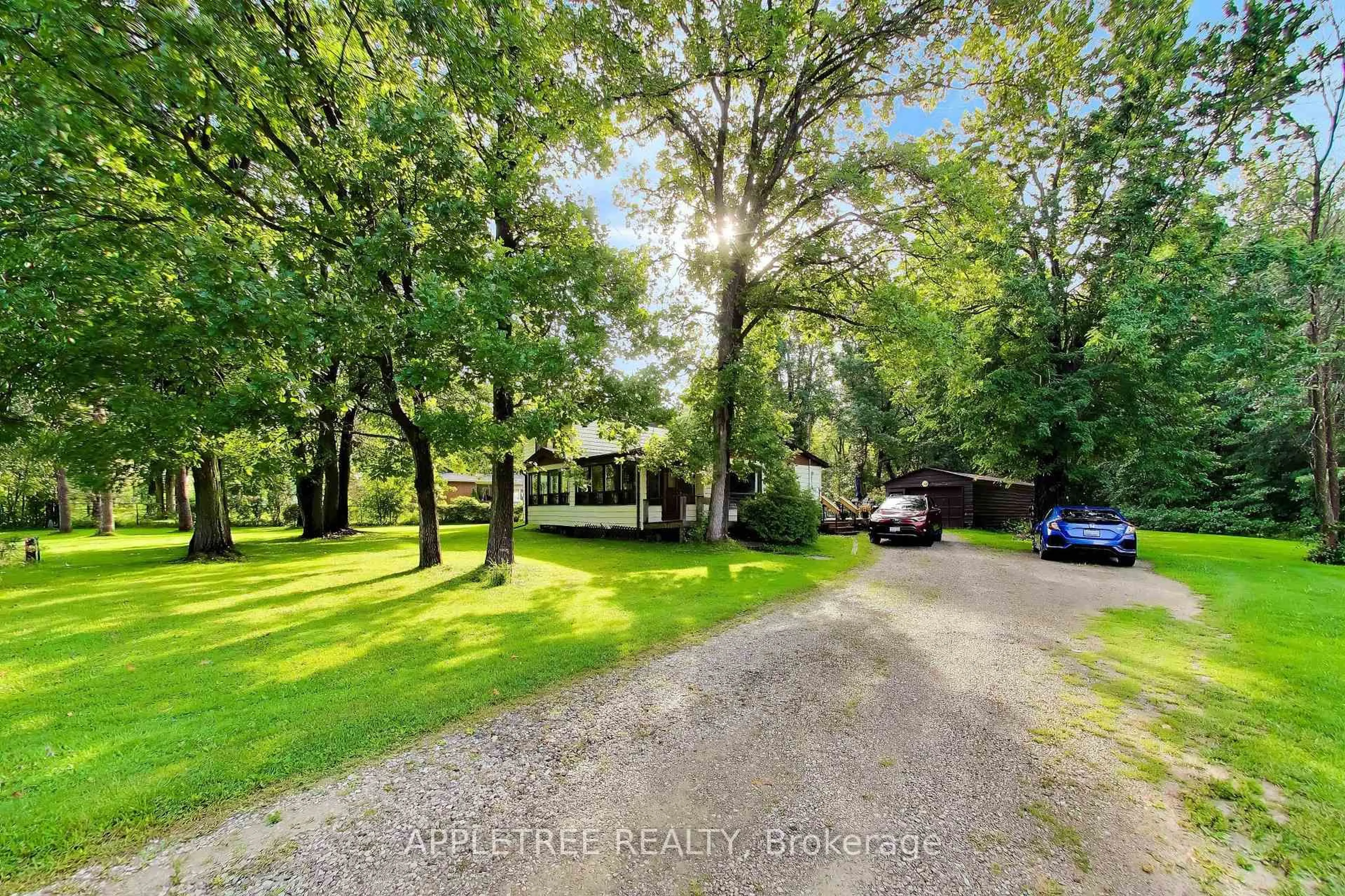 A pic from outside/outdoor area/front of a property/back of a property/a pic from drone, forest/trees view for 6171 Sheba Dr, Ramara Ontario L0K 1L0