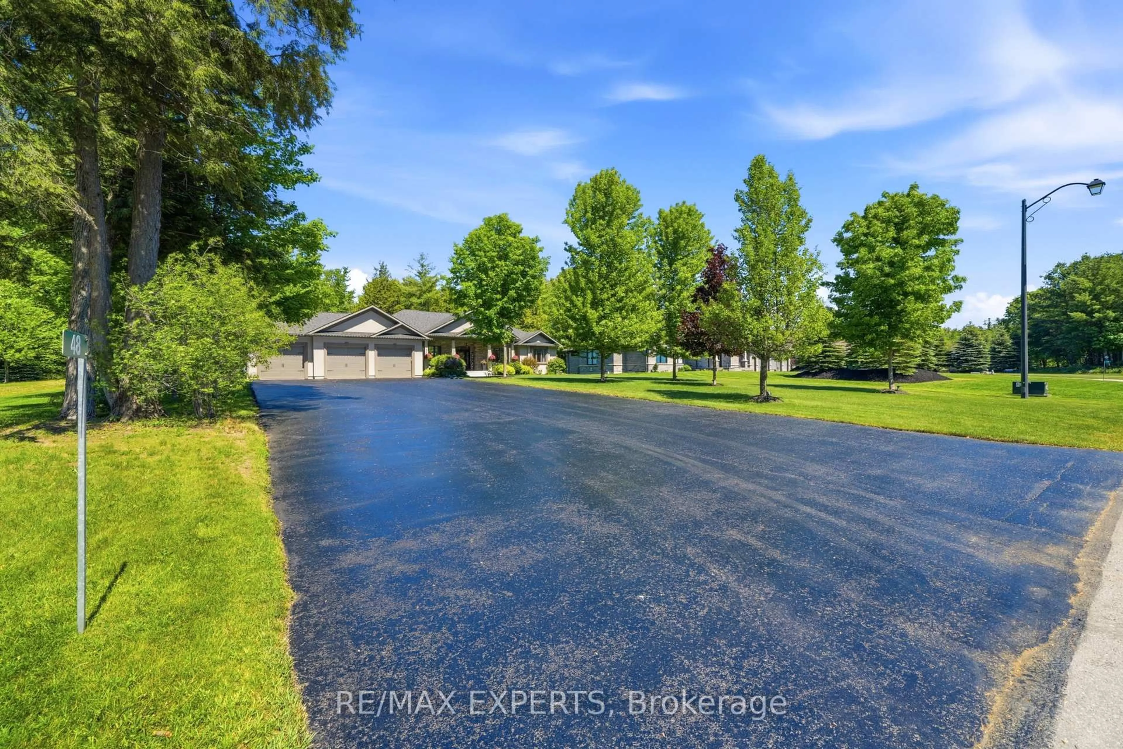 A pic from outside/outdoor area/front of a property/back of a property/a pic from drone, unknown for 48 Marni Lane, Springwater Ontario L0L 2K0
