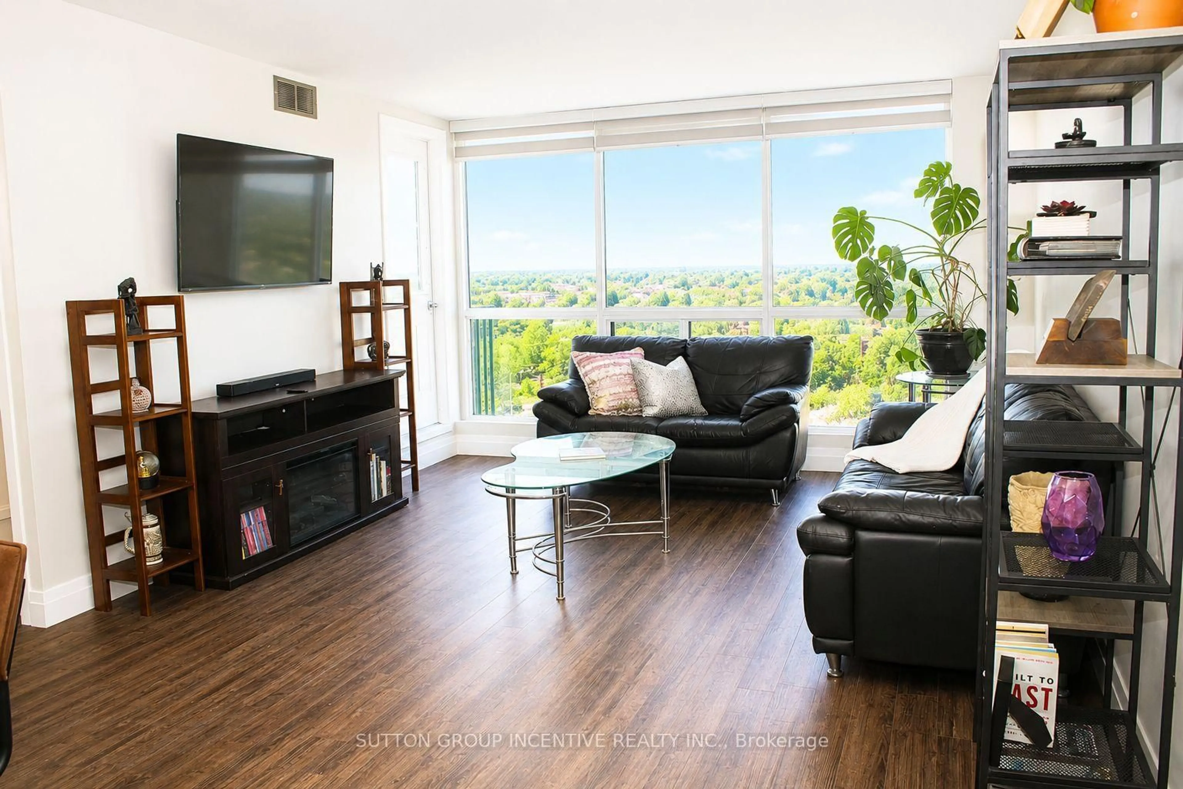 Living room with furniture, wood/laminate floor for 65 Ellen St #708, Barrie Ontario L4N 3A5